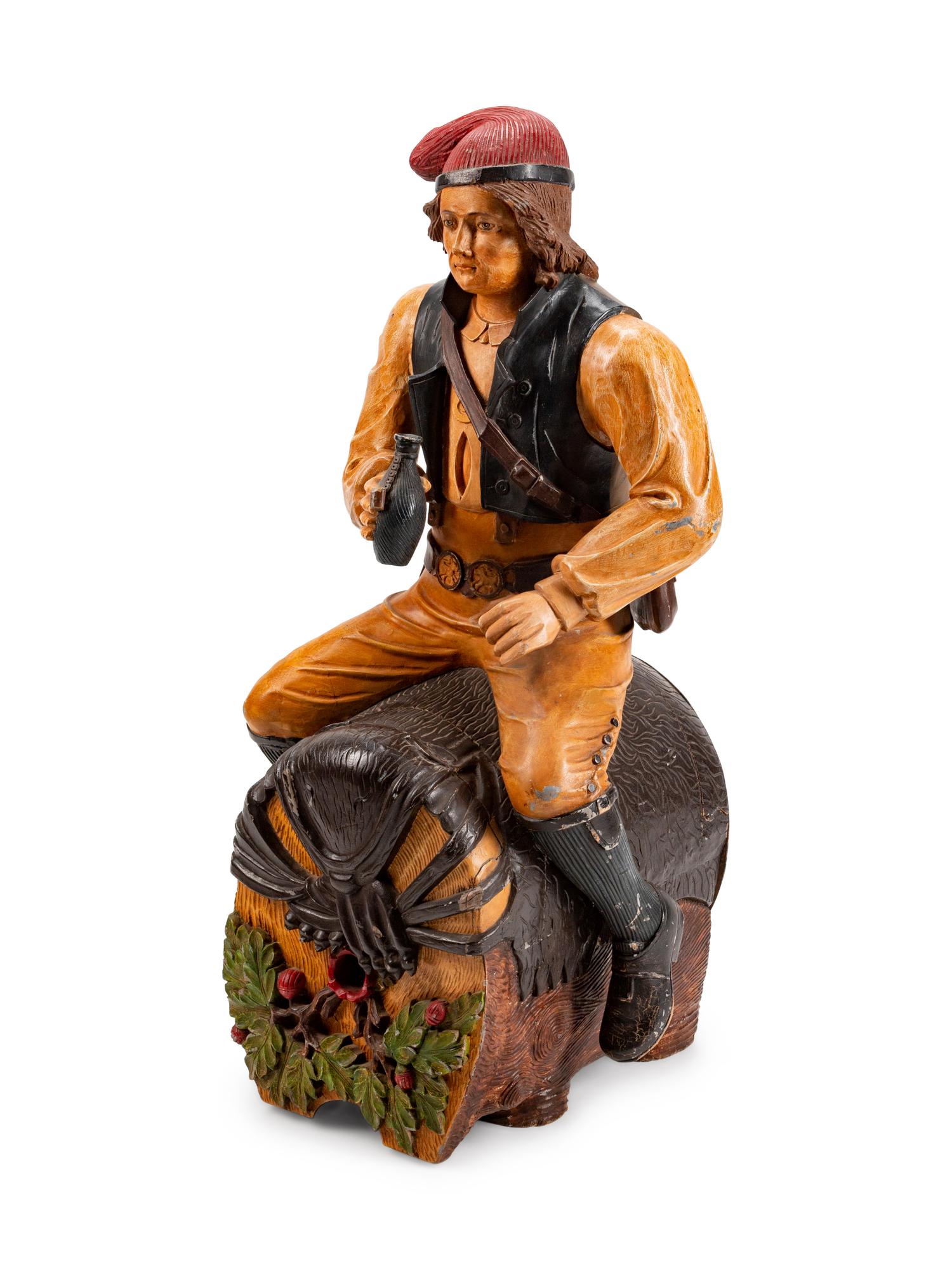A Dutch Carved and Polychromed Figure of a Man Astride a Wine Barrel