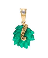 An 18 Karat Yellow Gold, Emerald and Diamond Native American Head Pendant, 1.70 dwts.