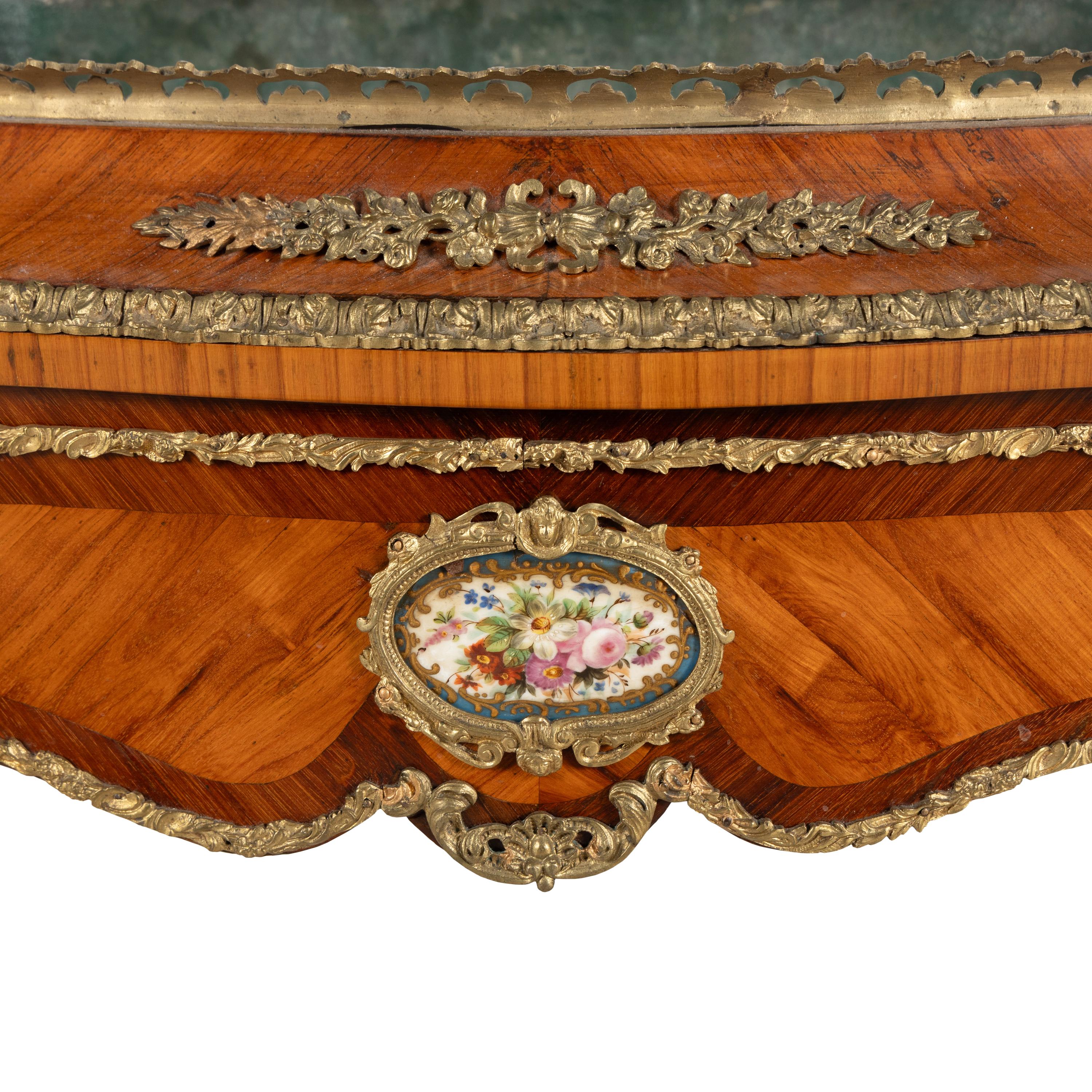 A French Kingwood, Tulipwood, Gilt Bronze and Porcelain Mounted Jardinière Table