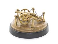 A Brass Model of a Cannon, Diameter overall 5 1/2 inches.