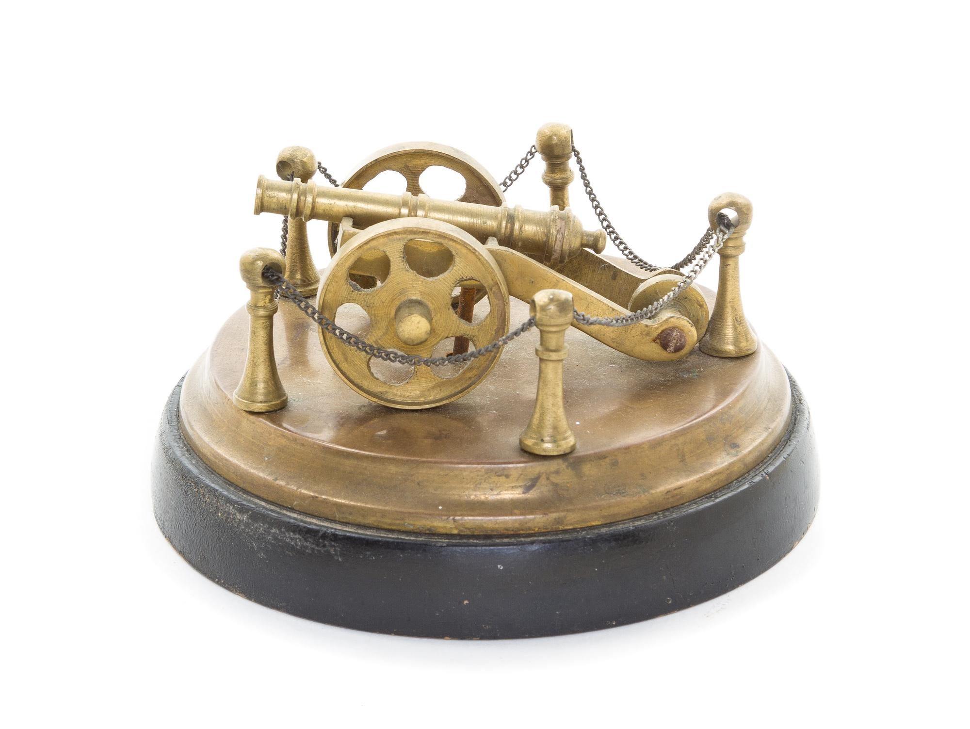 A Brass Model of a Cannon, Diameter overall 5 1/2 inches.