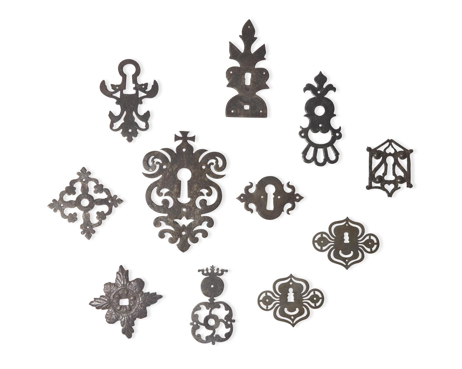 A Collection of Eleven Wrought Iron Escutcheons or Back Plates, French, 16th - 18th Century