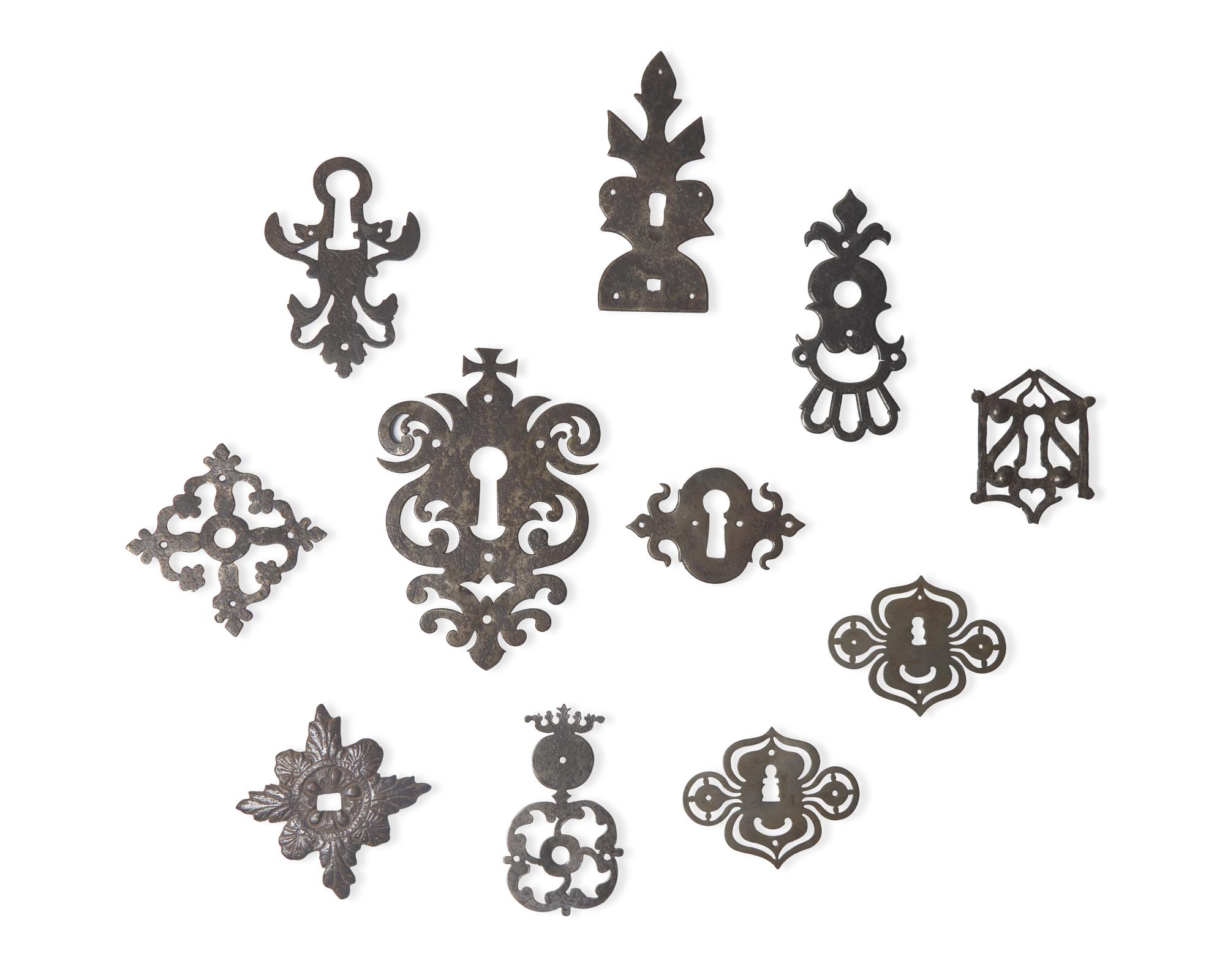 A Collection of Eleven Wrought Iron Escutcheons or Back Plates, French, 16th - 18th Century