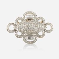 A diamond and white gold brooch