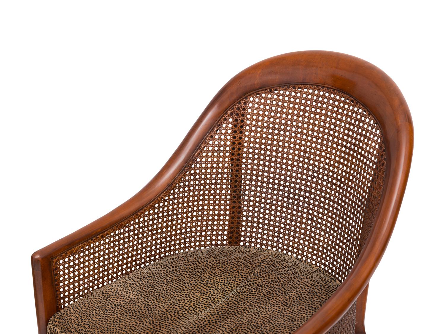 A Pair of Regency Style Walnut and Cane Barrel Chairs
