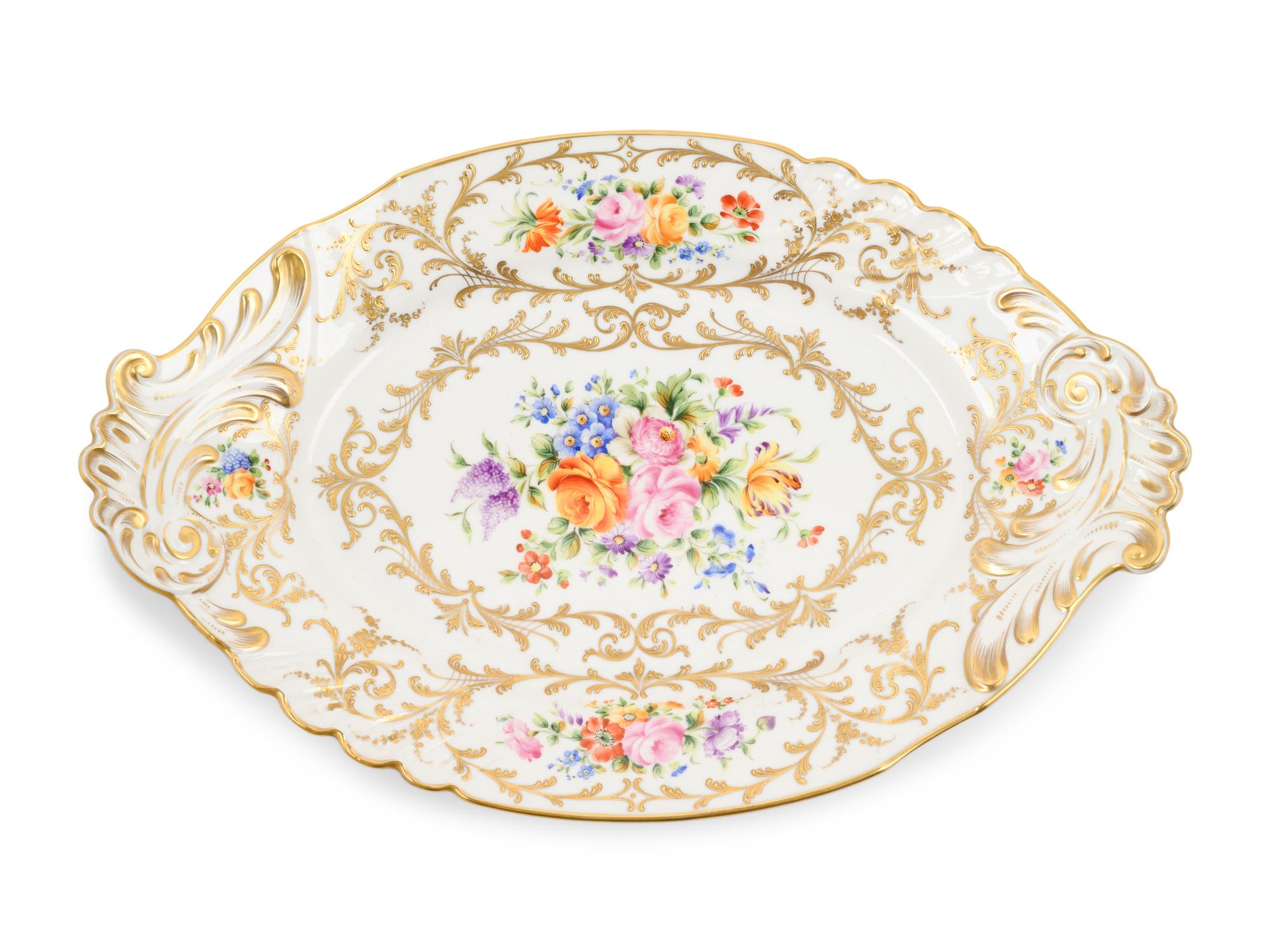 A French Parcel Gilt and Hand Painted Porcelain Tureen