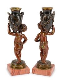 A Pair of French Patinated Bronze Figures of Infant Water Carriers — CIRCA 1900