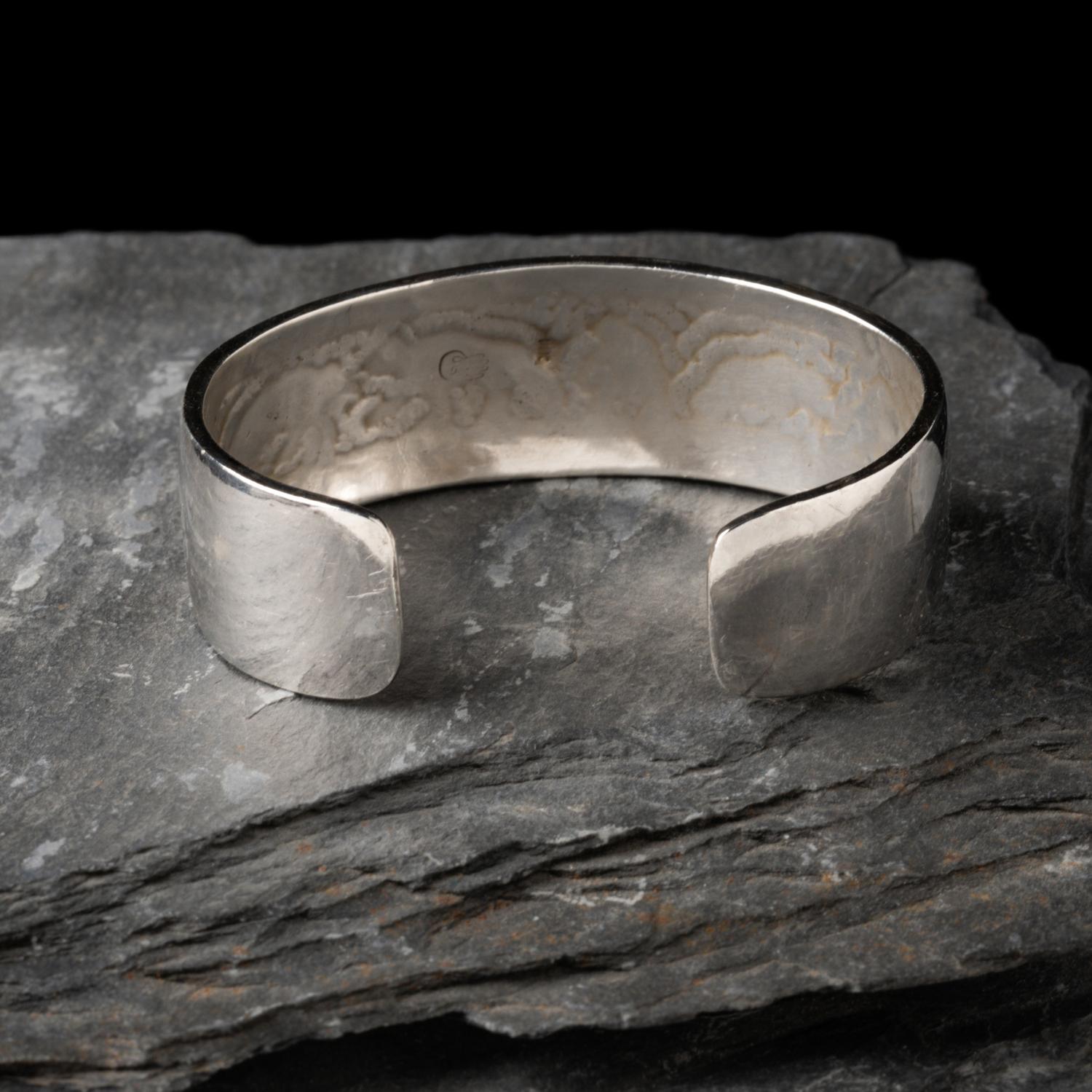Watson Honanie (Hopi, 1953-2023) — Sterling Silver with 14K Gold Overlay Cuff Bracelet, with Bear Scene