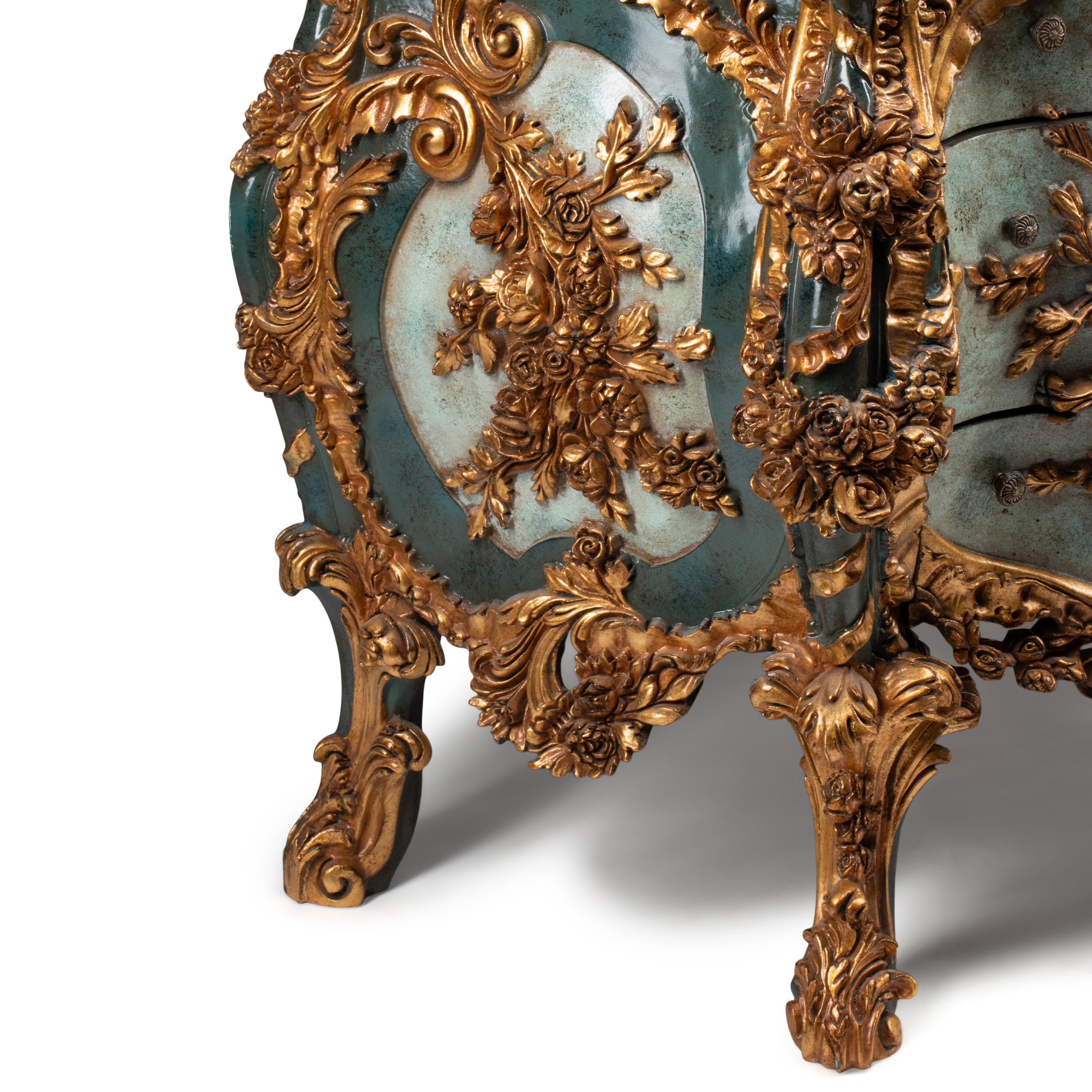 An Italian Carved, Painted and Parcel Gilt Commode