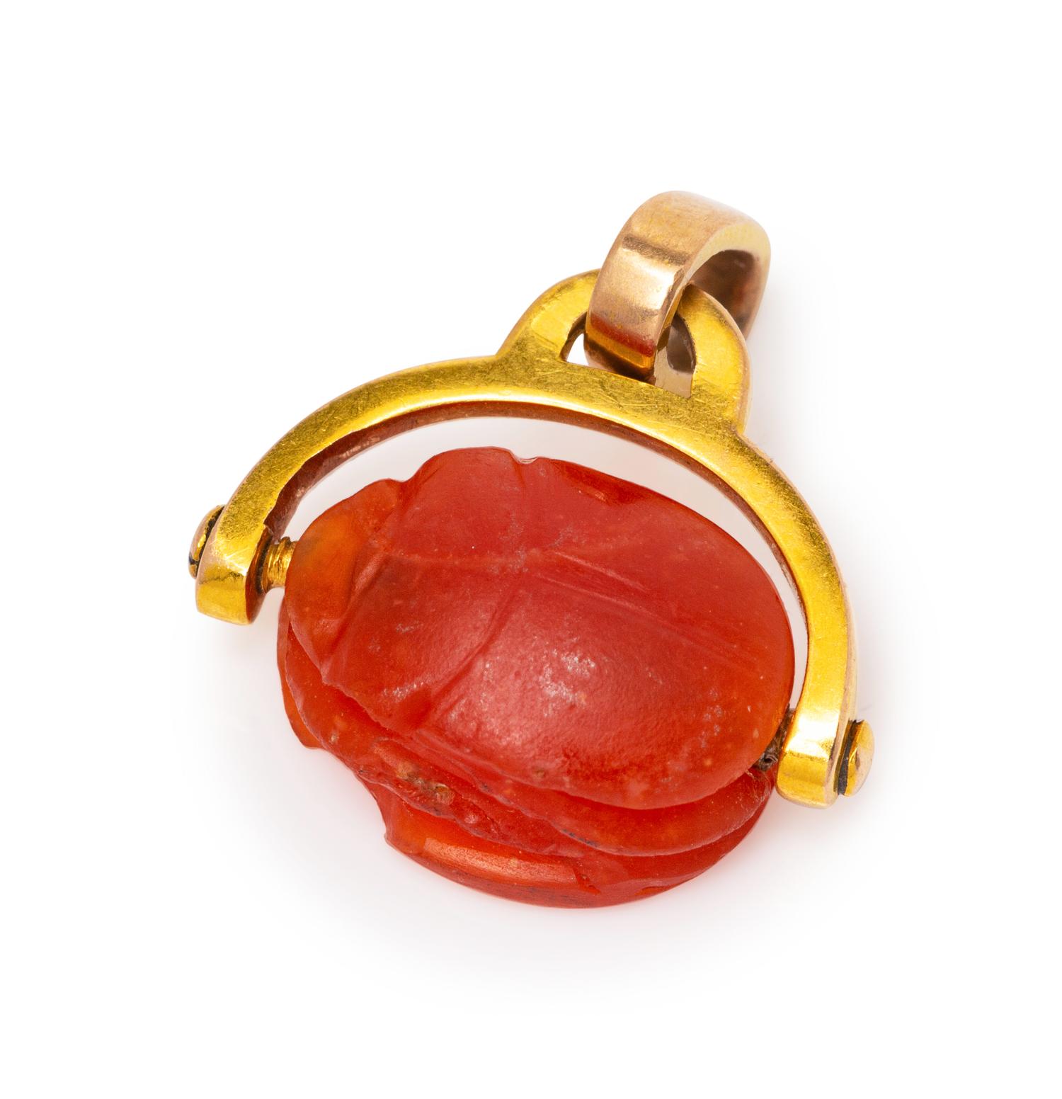 A Possibly Ancient Yellow Gold and Carved Carnelian Scarab Pendant,