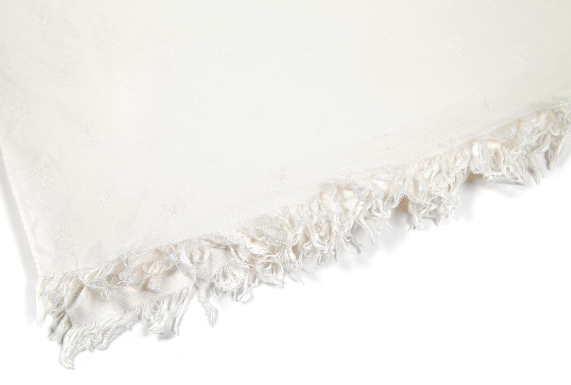 An Hermès Cream Wool and Silk Jacquard Scarf, 55.5" x 35".
