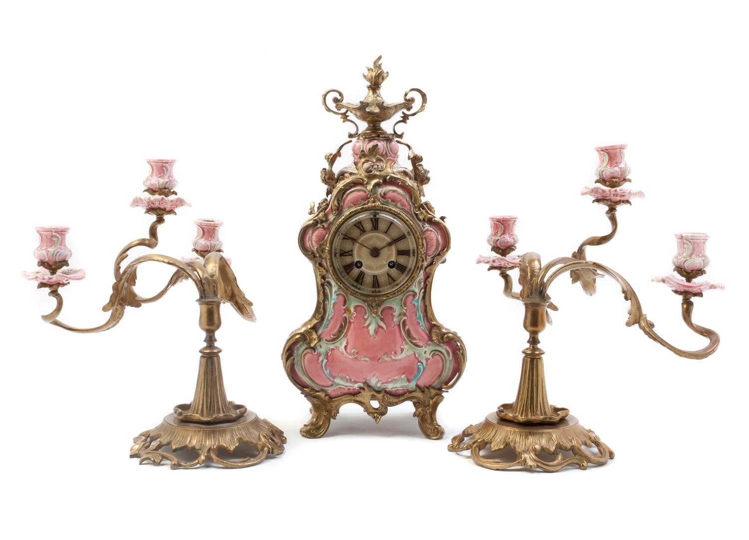 A German Porcelain and Gilt Metal Mounted Clock Garniture, Lenzkirch, Height of clock 18 inches.