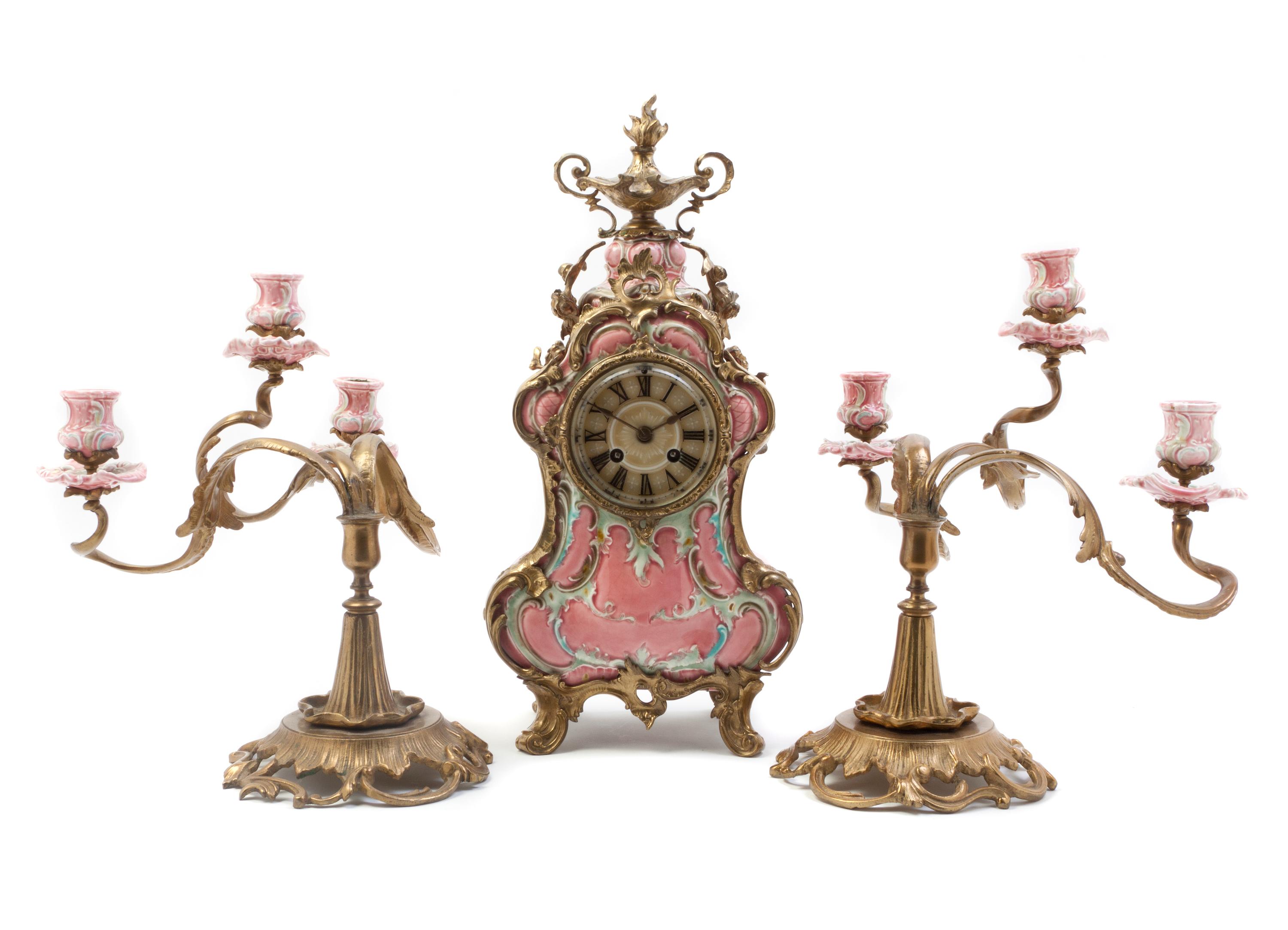 A German Porcelain and Gilt Metal Mounted Clock Garniture, Lenzkirch, Height of clock 18 inches.