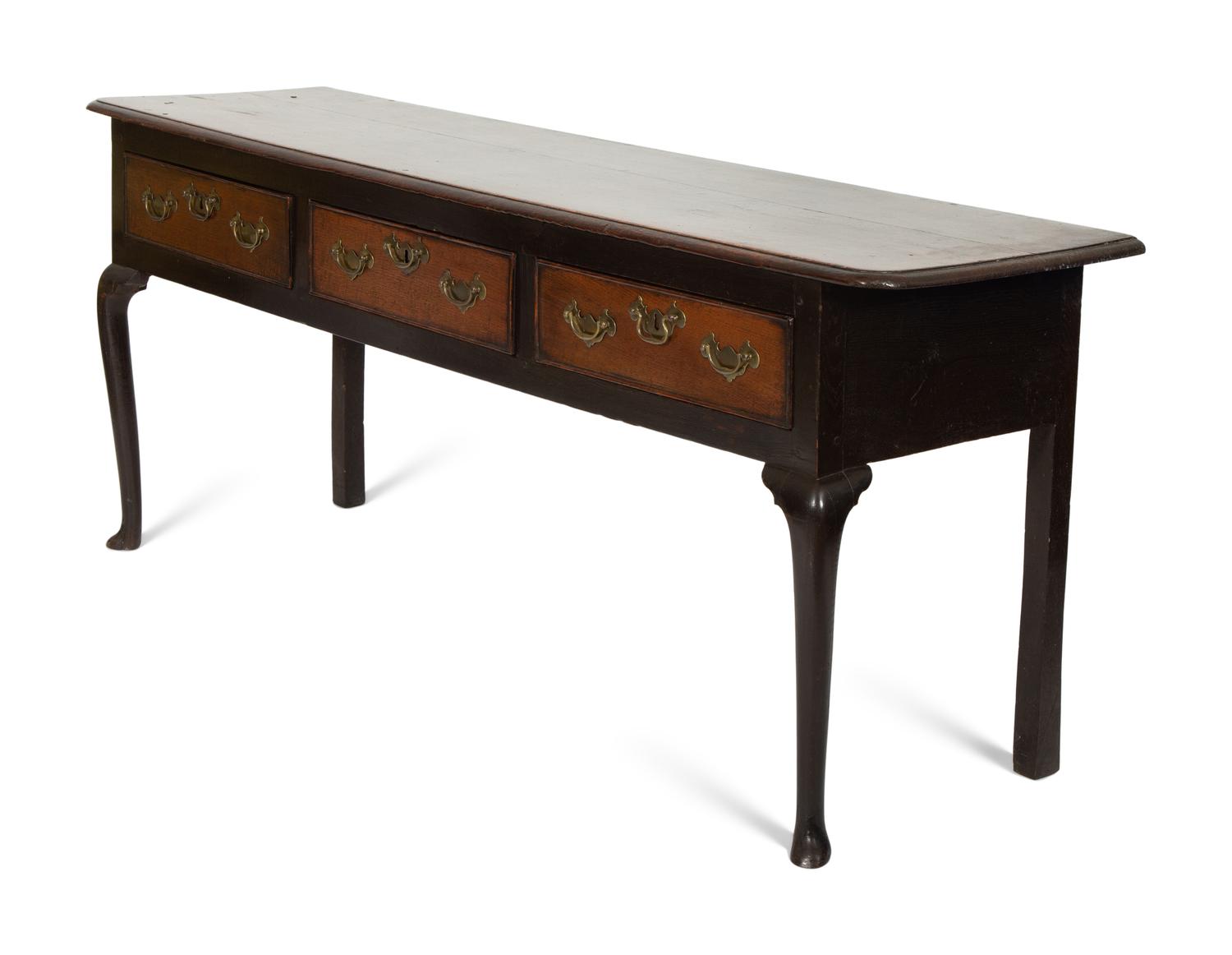 A Queen Anne Oak Three Drawer Sideboard