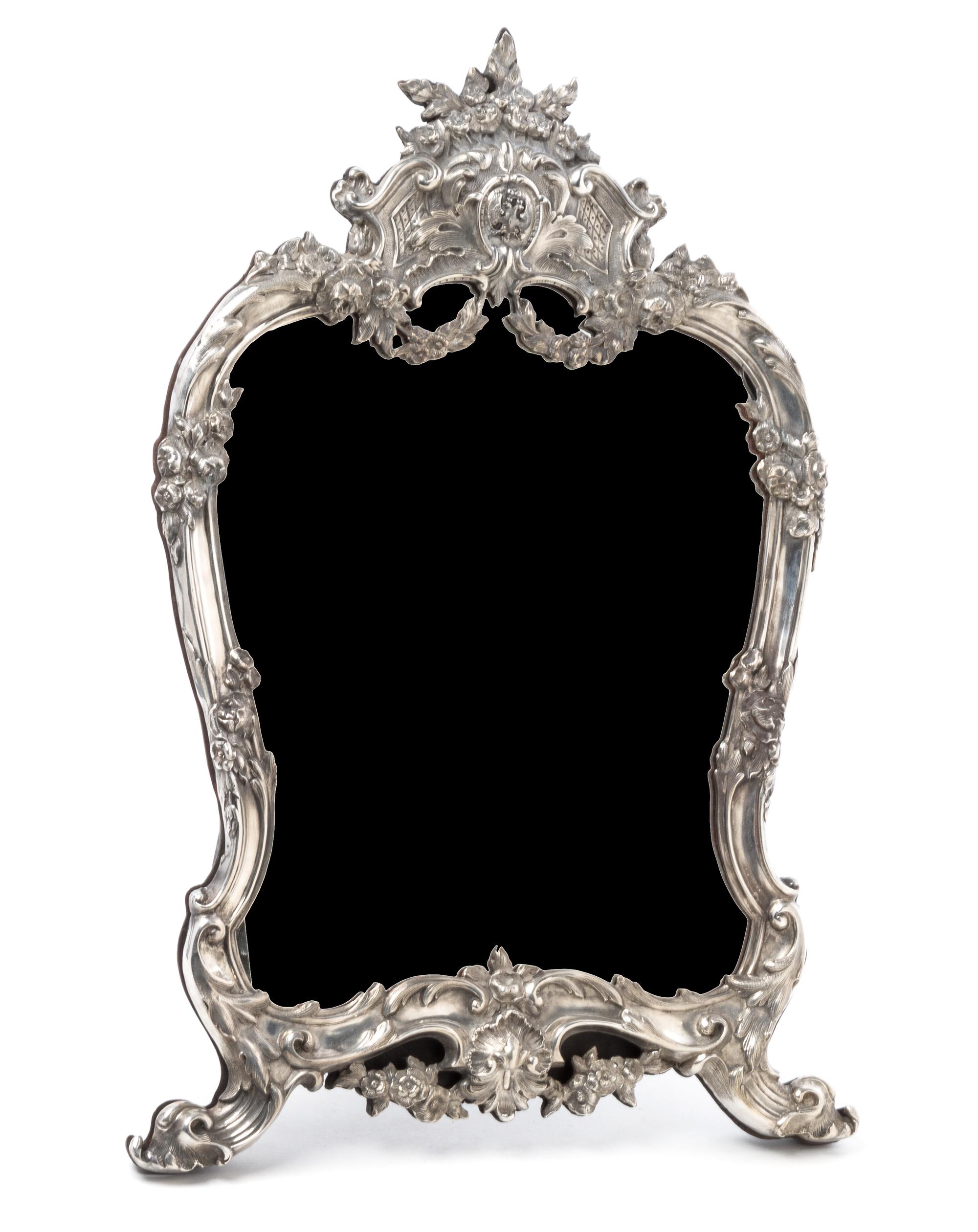A Russian Silver Table Mirror, Mark of Faberge, St. Petersburg, 20th century, having a floral crest above an applied double-headed eagl