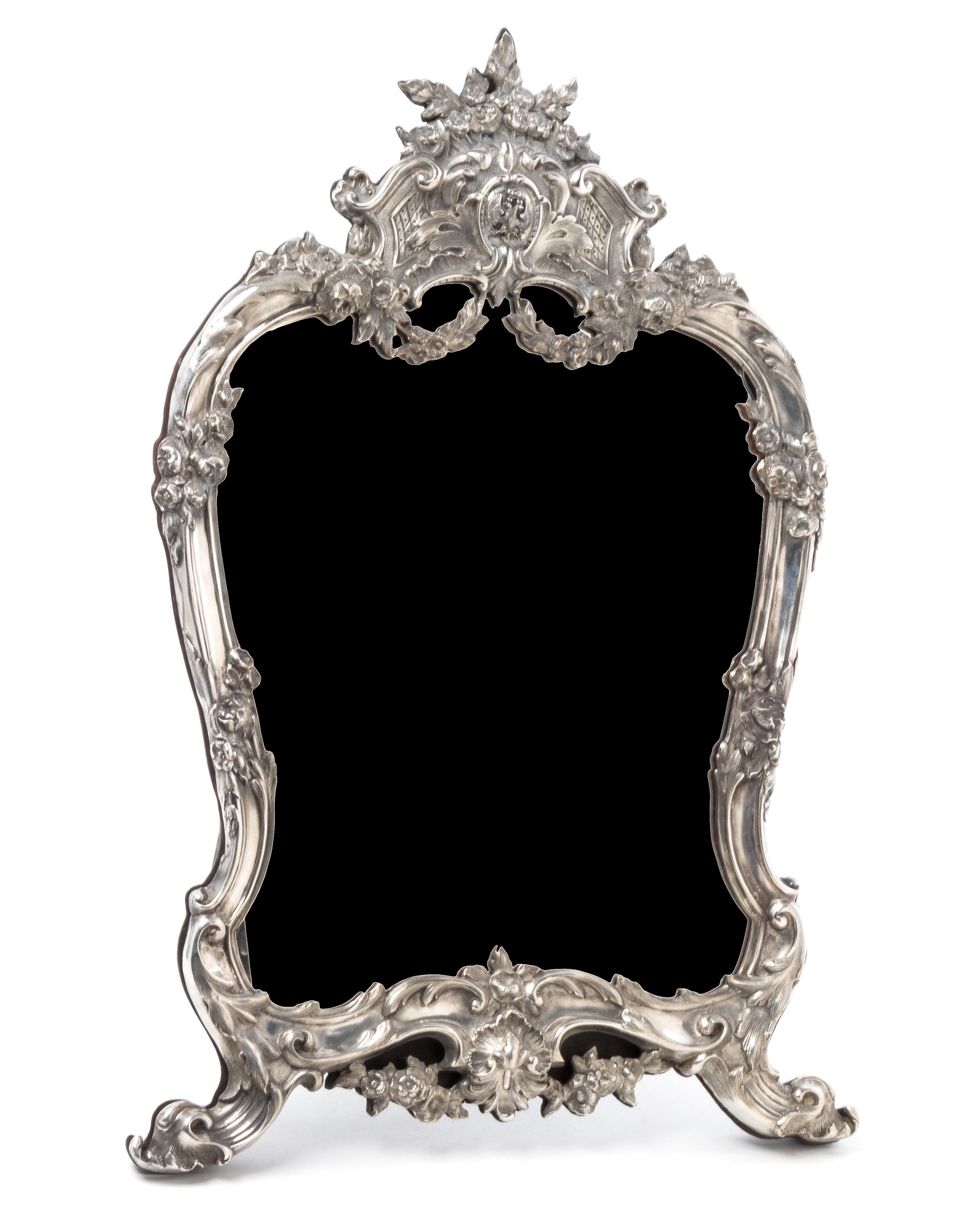 A Russian Silver Table Mirror, Mark of Faberge, St. Petersburg, 20th century, having a floral crest above an applied double-headed eagl