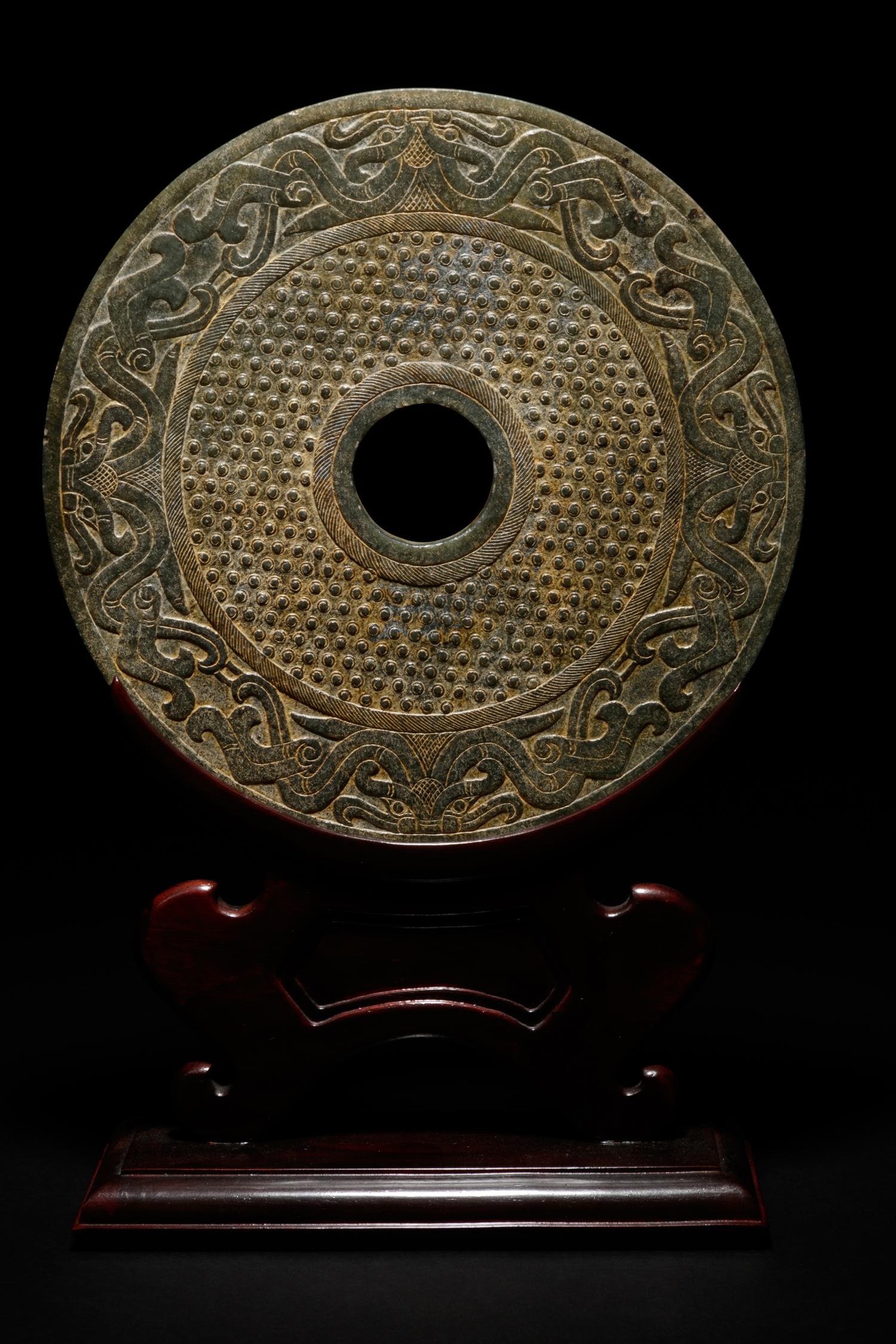 A Chinese Liangzhu-s tyle Carved Nephrite Jade Bi Disc