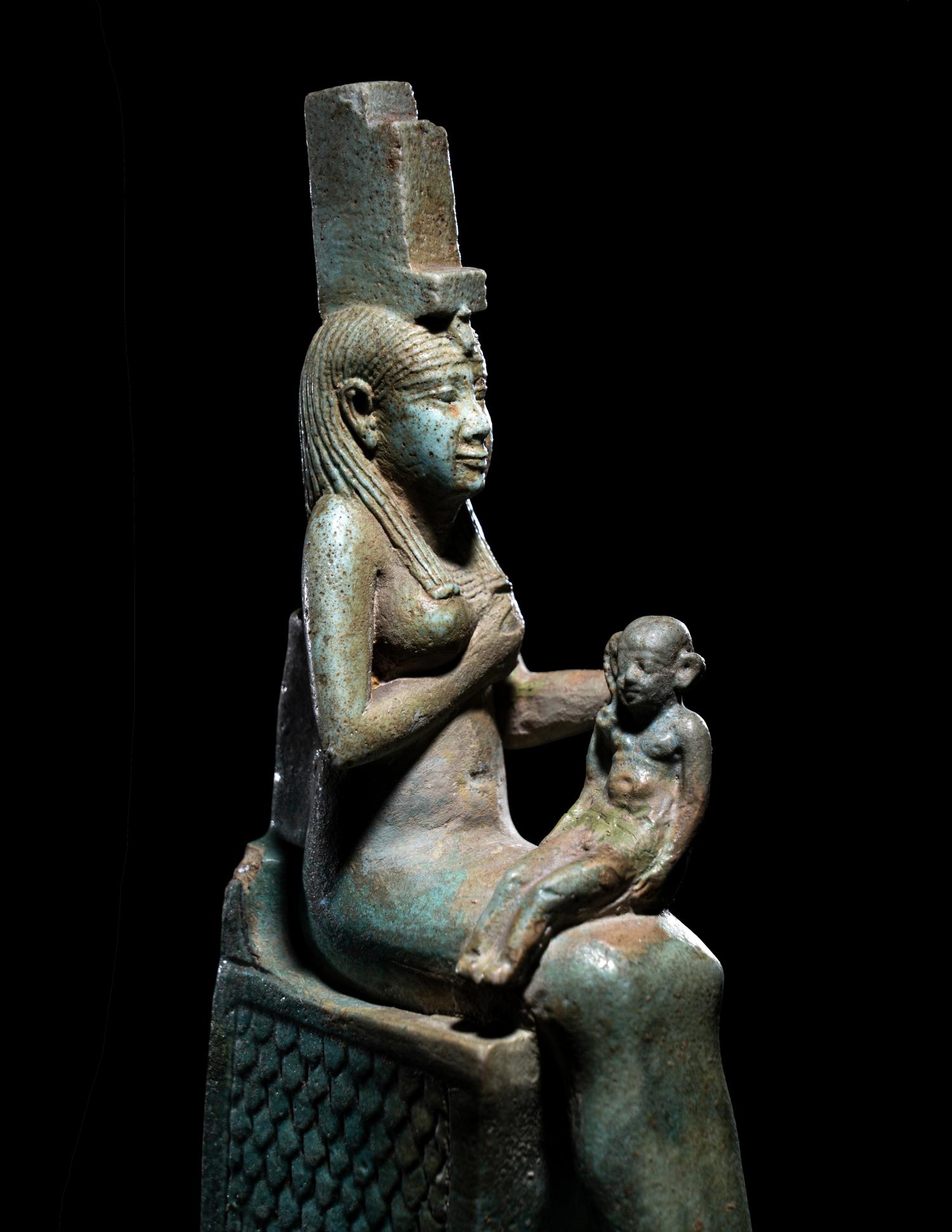 An Egyptian Faience Isis Nursing Harpocrates
