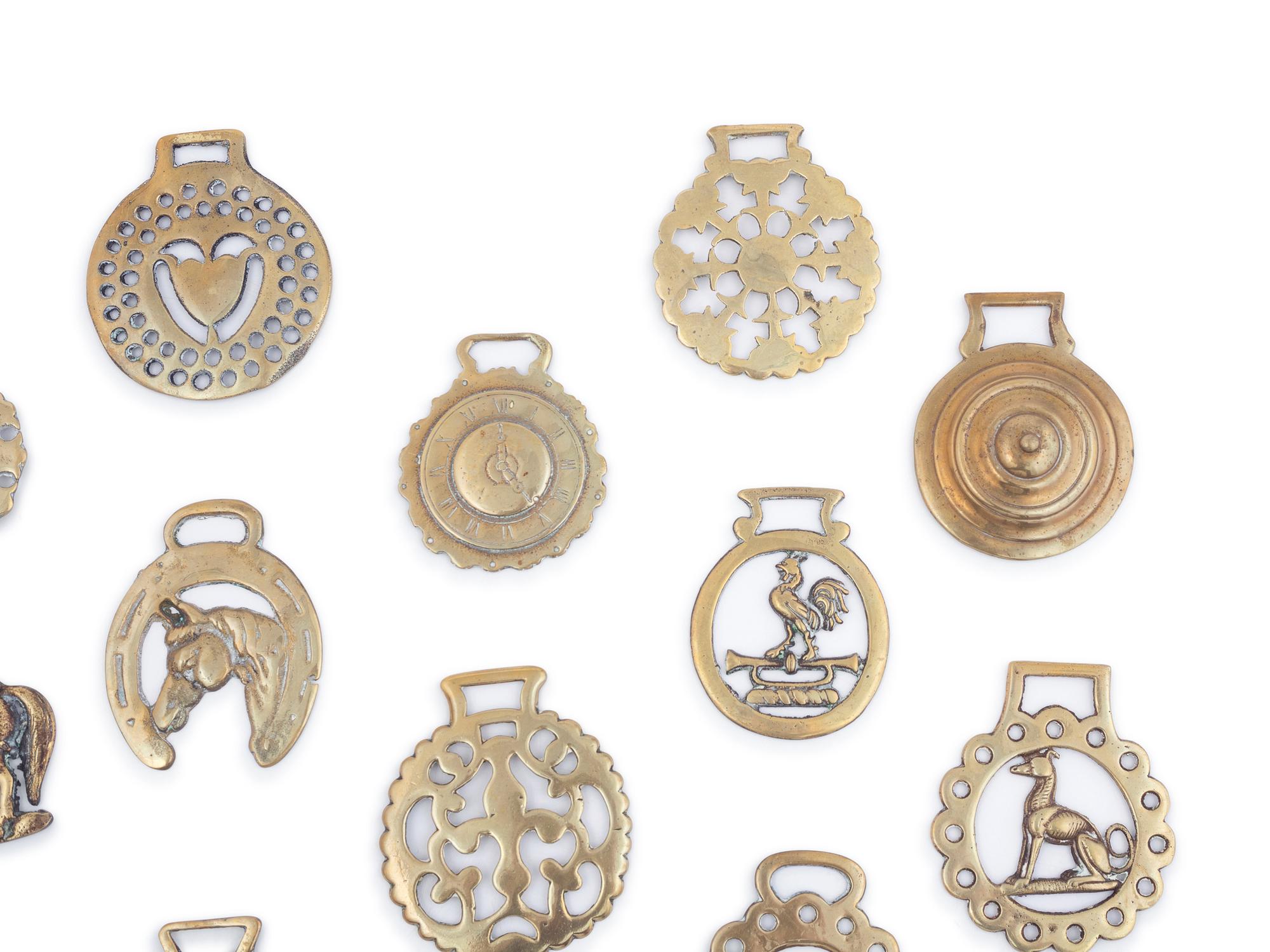 A Collection of Twenty Five Pressed and Cast Brass Buckles