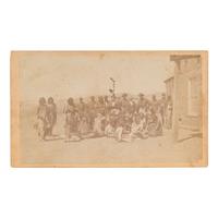 [NATIVE AMERICANS]. CDV of large group of Native Americans posed with soldiers and a civilian. N.p.: n.p., [ca 1860s].