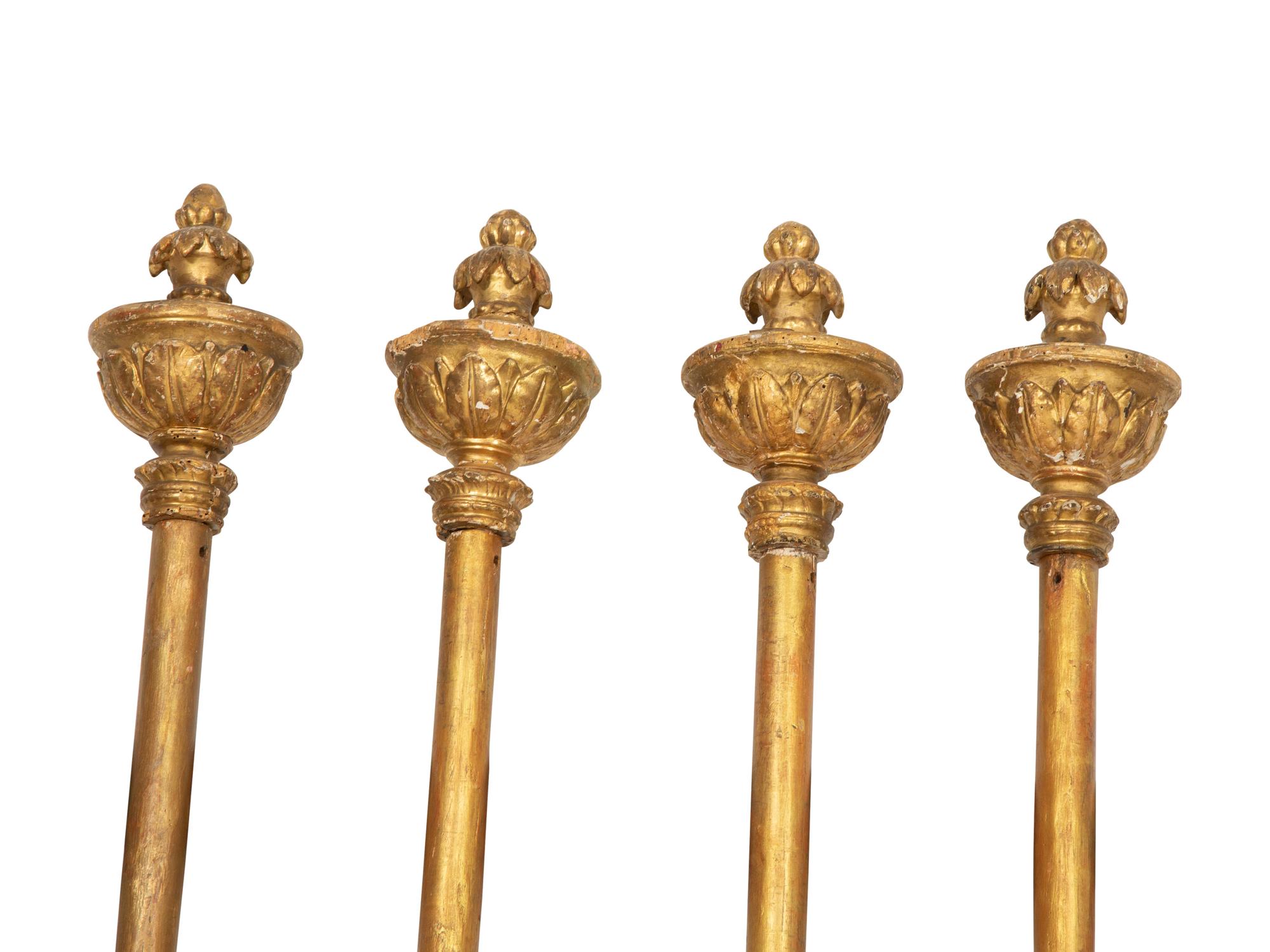 Four Italian Painted and Parcel Gilt Processional Poles