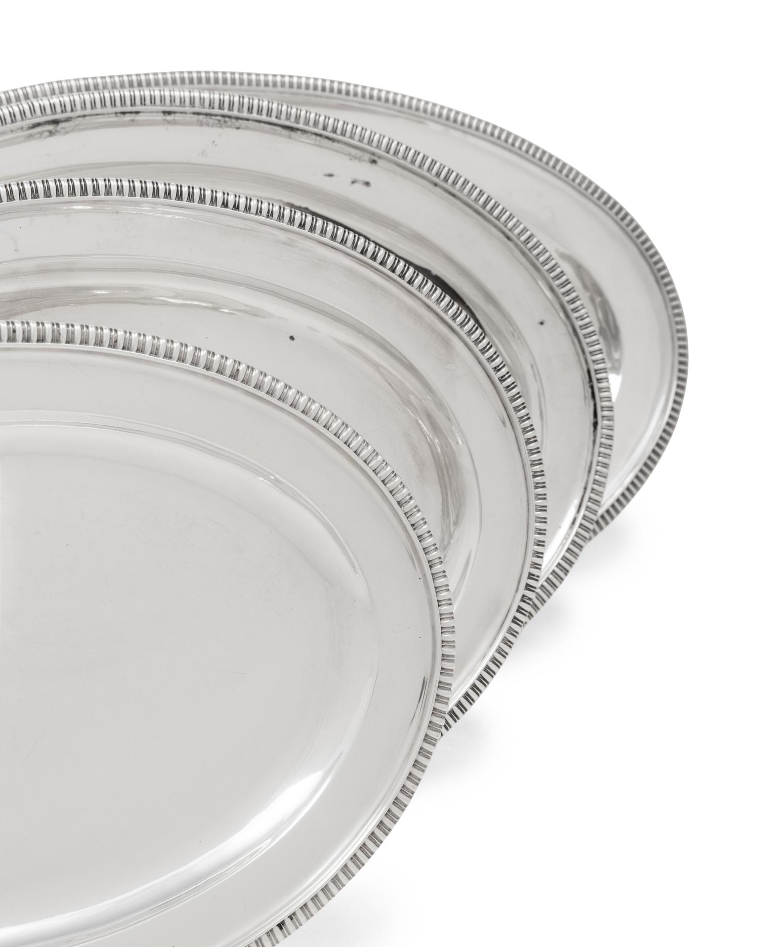 A Group of Four English Silver Serving Trays