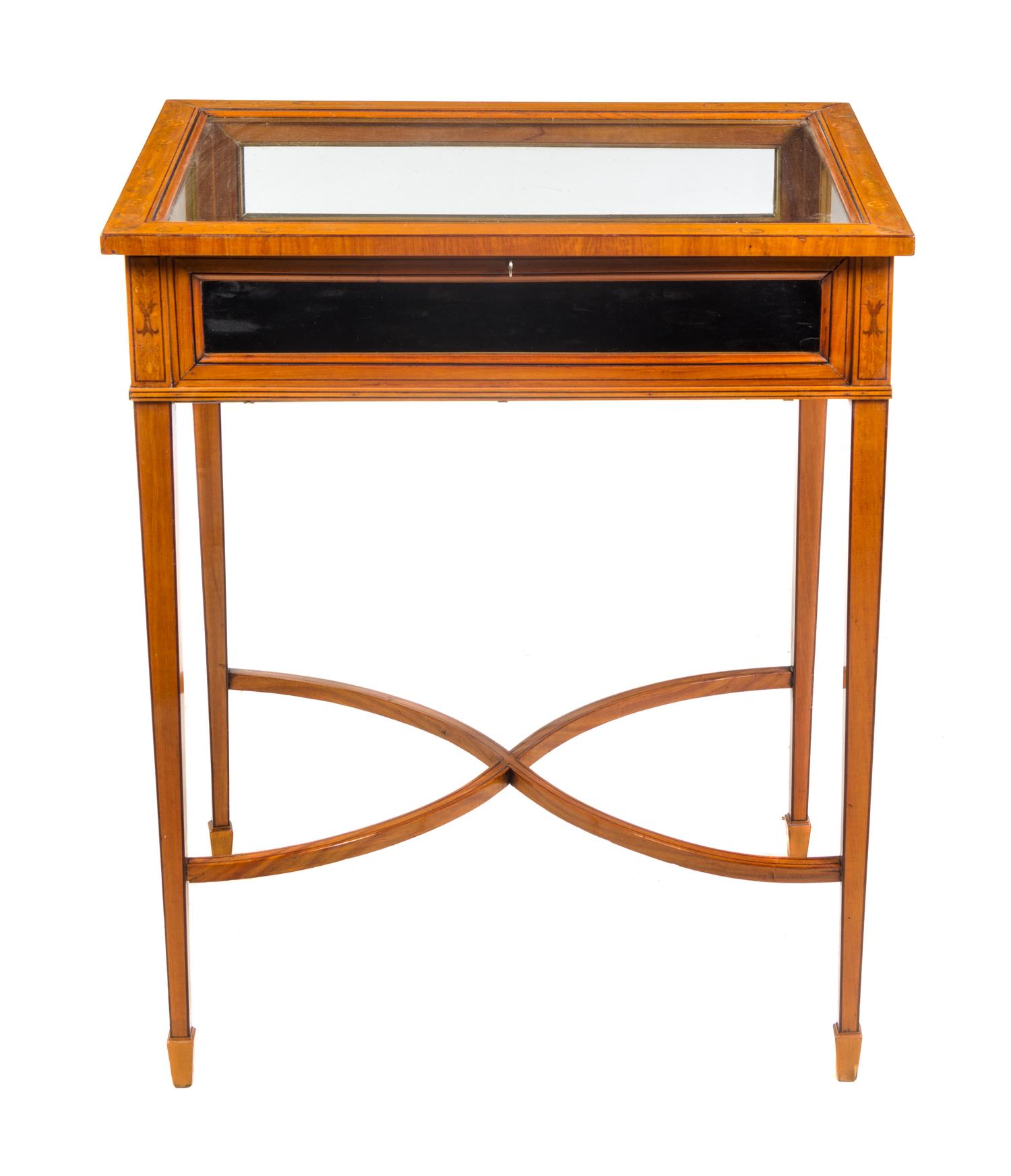 An Edwardian Mahogany Vitrine Table Height 29 5/8 x width 24 x depth 16 1/2 inches. — CIRCA 1910