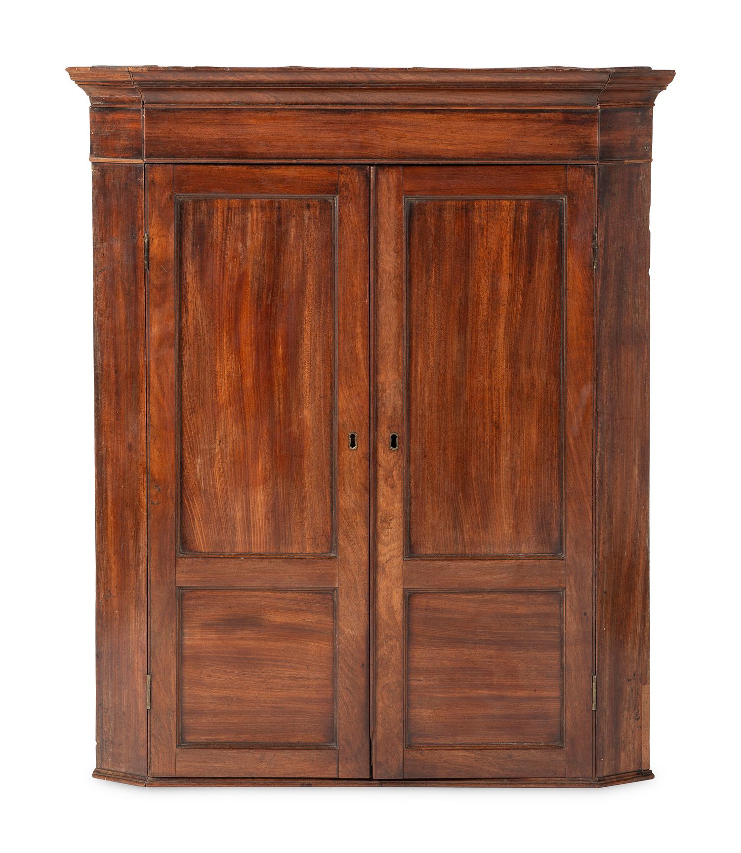 A Chippendale Figured and Paneled Mahogany Hanging Corner Cabinet