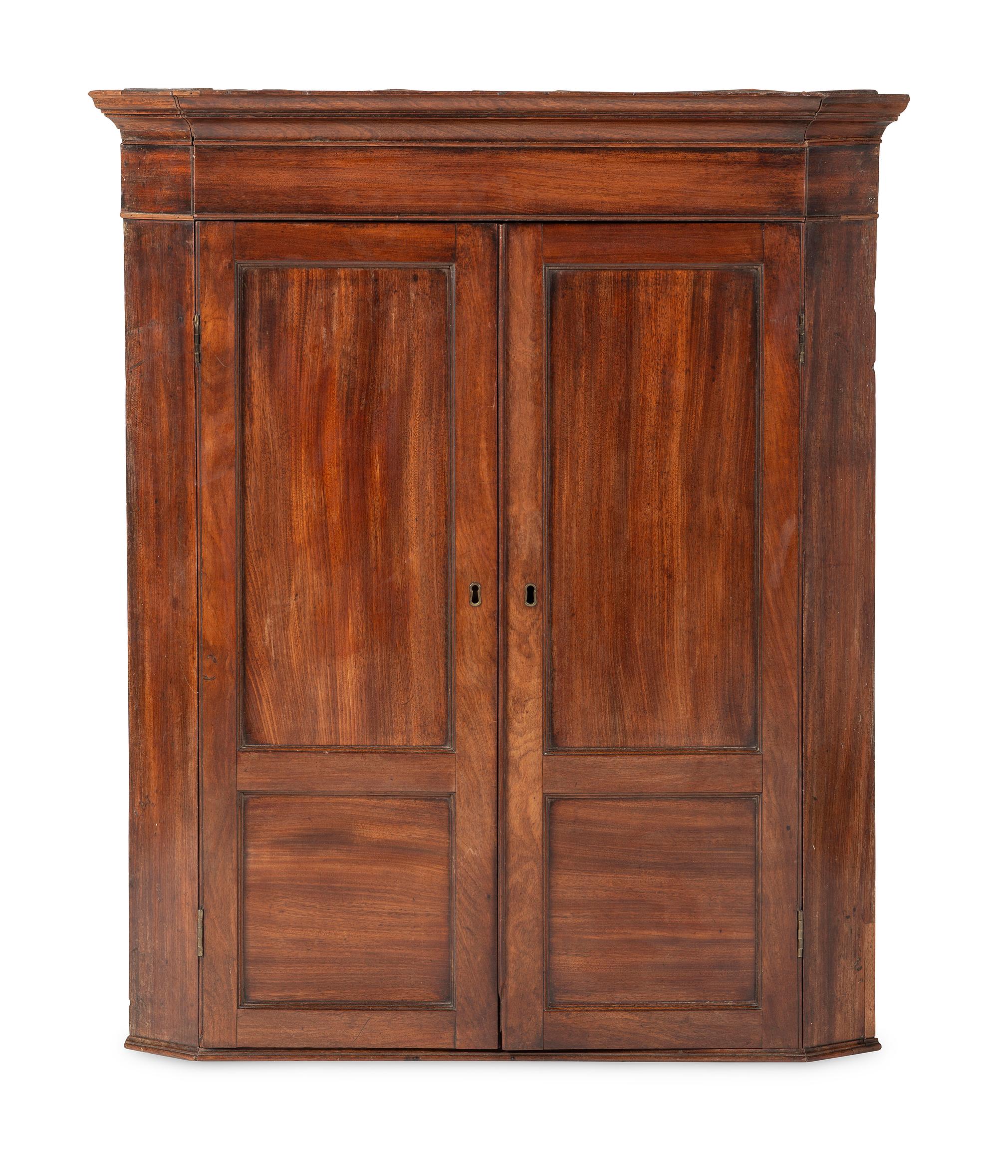 A Chippendale Figured and Paneled Mahogany Hanging Corner Cabinet
