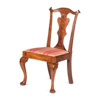 A Queen Anne Carved and Figured Walnut Side Chair