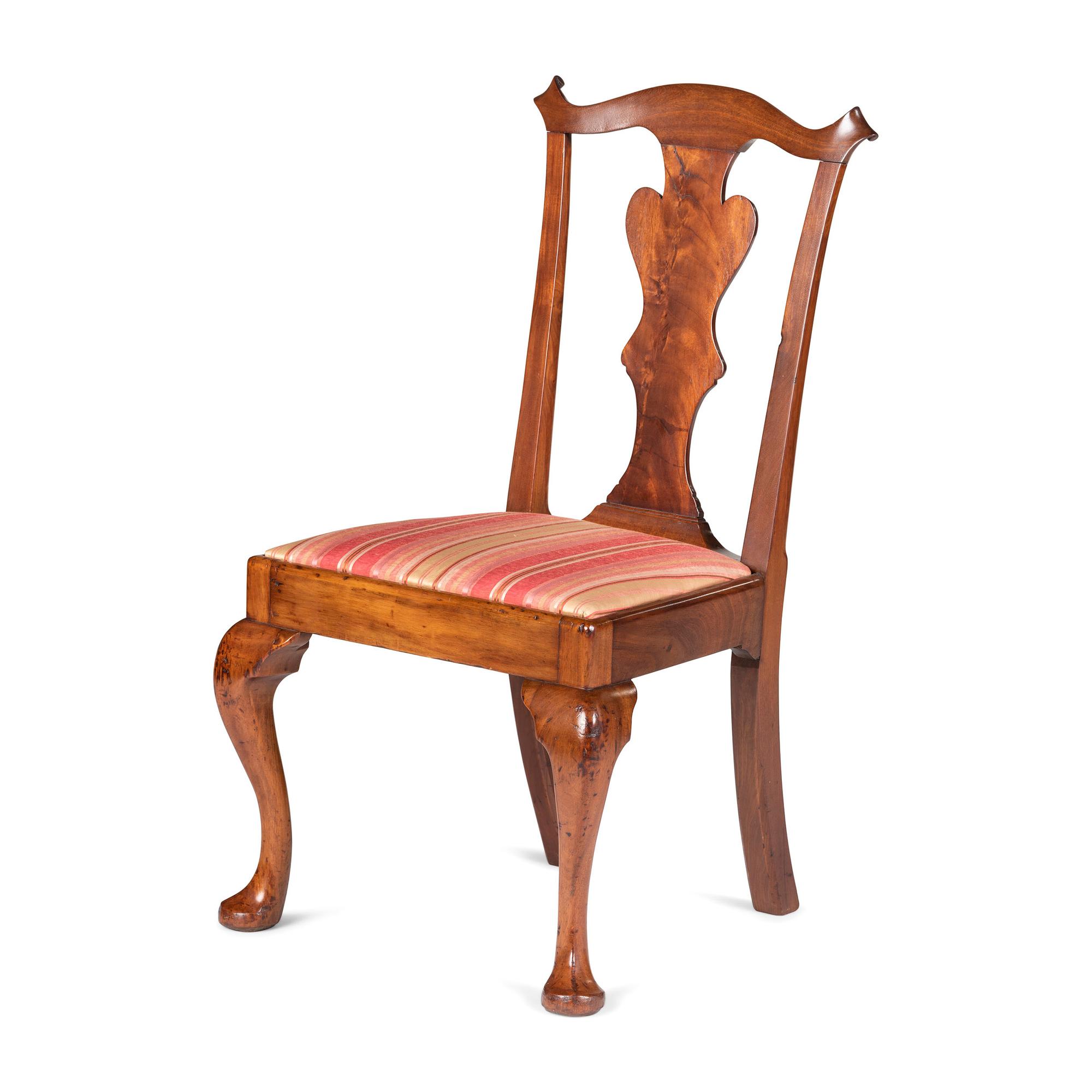 A Queen Anne Carved and Figured Walnut Side Chair