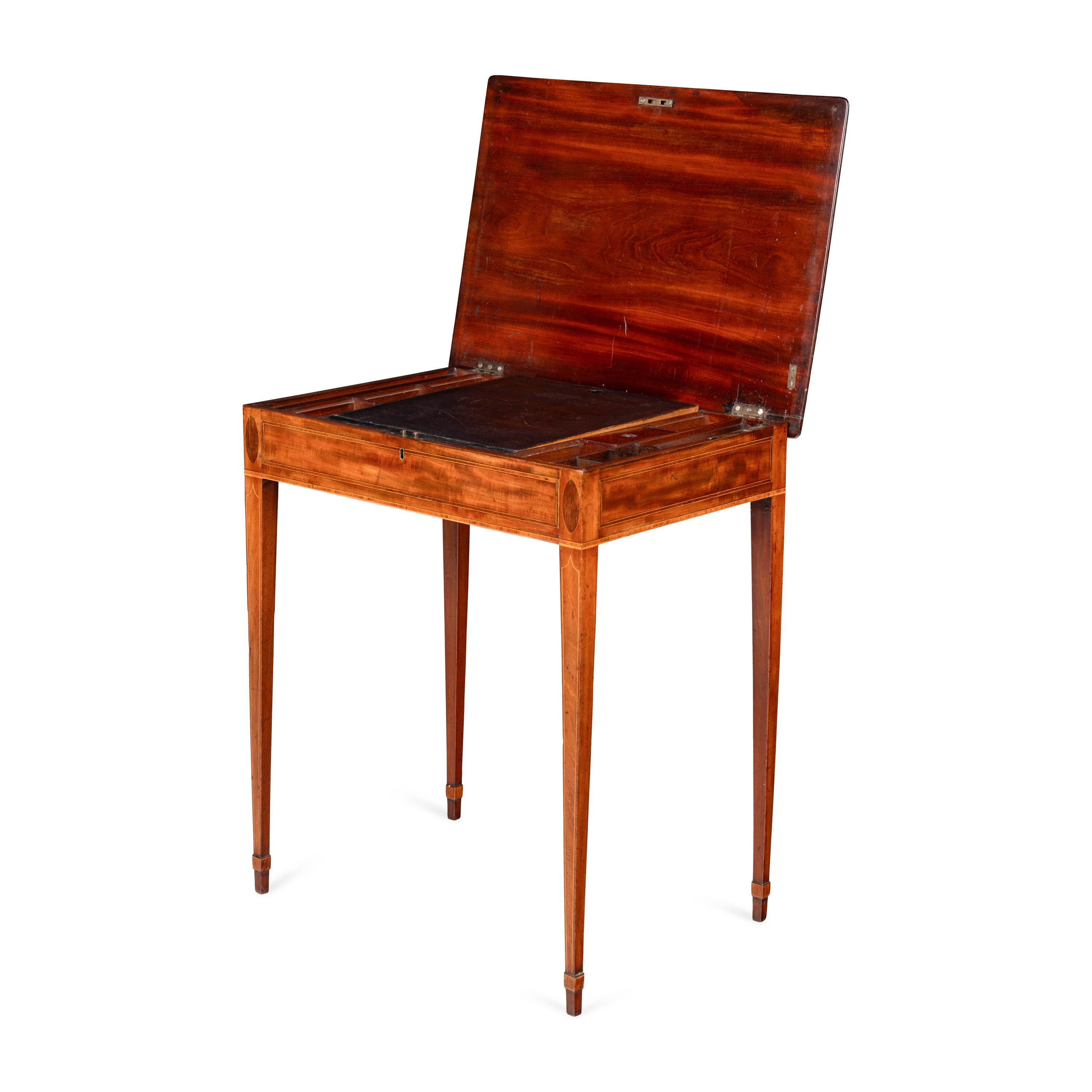 A George III Mahogany Lift-Top Writing Table