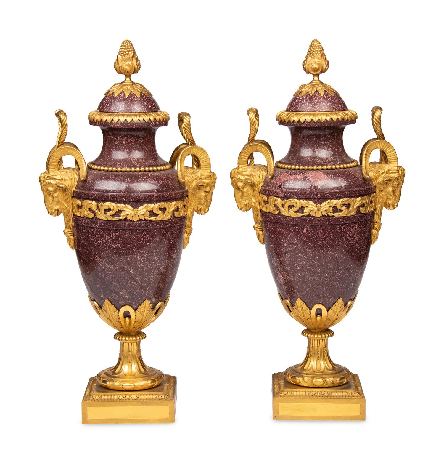 A Pair of Louis XVI Style Gilt Bronze Mounted Porphyry Urns