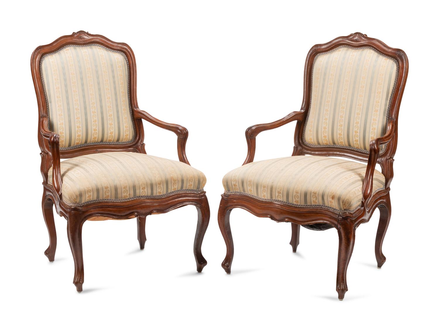 A Pair of Louis XV Walnut Fauteuils
