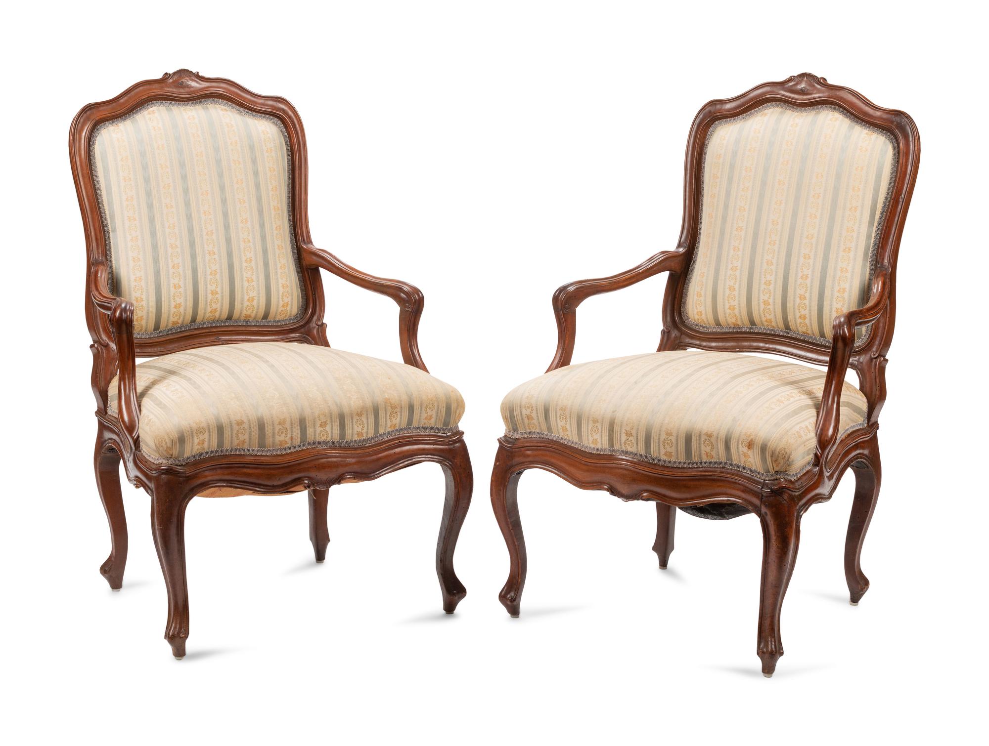 A Pair of Louis XV Walnut Fauteuils
