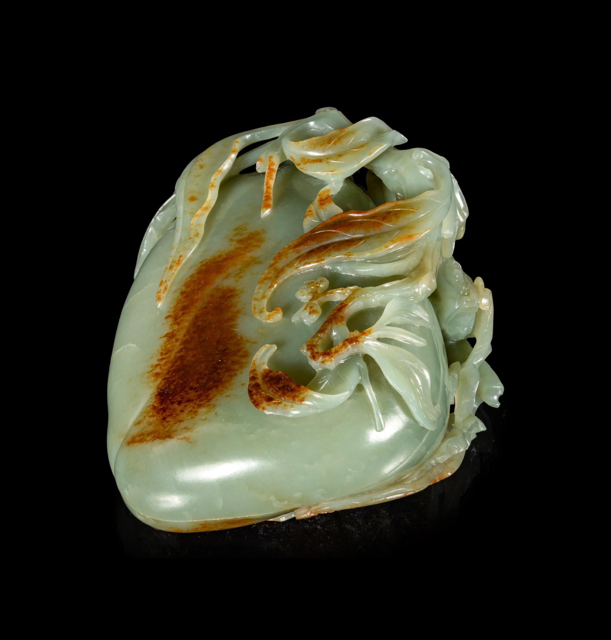 A Russet and Celadon Jade 'Peach and Bat' Covered Box