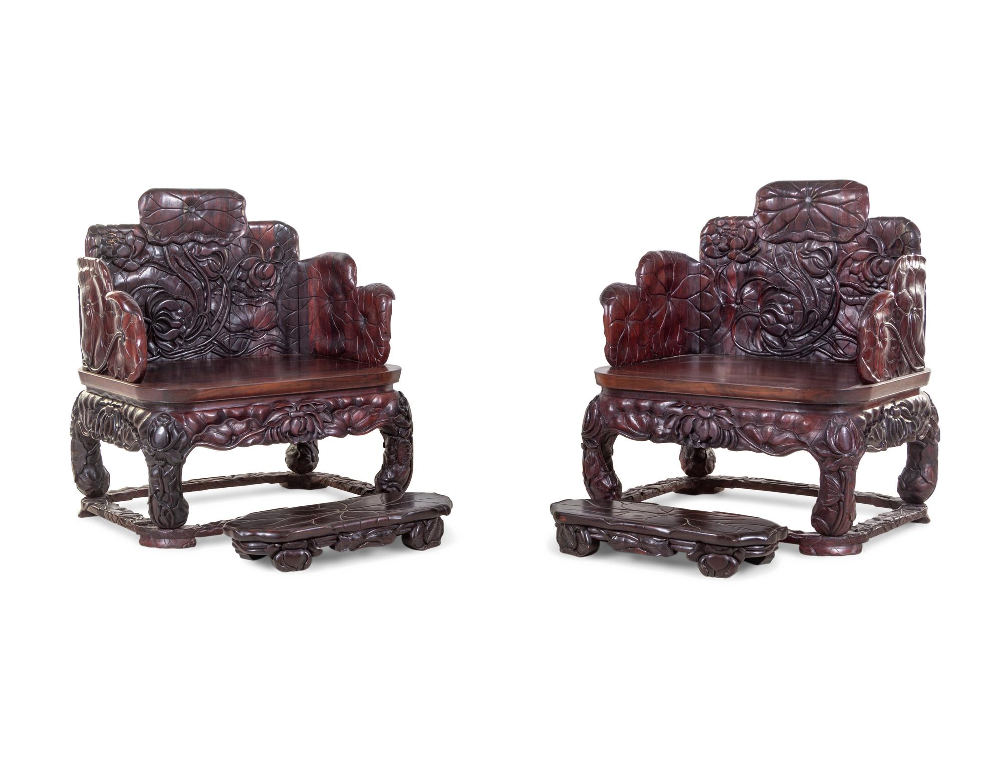 A Pair of Chinese Export Carved Hardwood Armchairs and Footrests