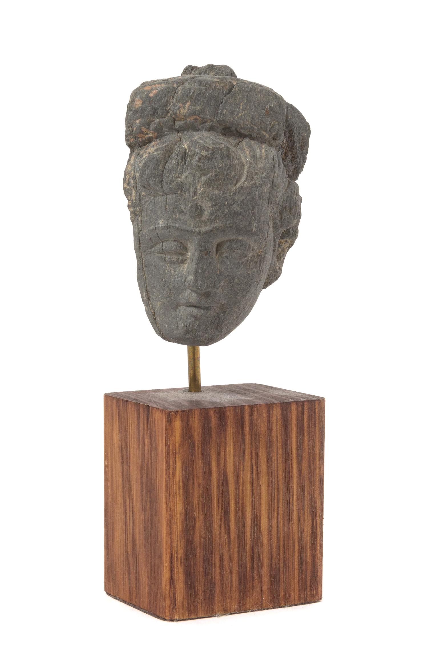 A Gandharan Gray Schist Head of a Male Height 2 3/4 inches.
