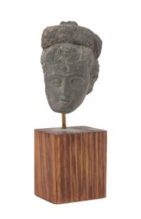 A Gandharan Gray Schist Head of a Male Height 2 3/4 inches.