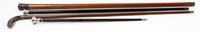 A Group of Four Canes Height of tallest 37 1/2 inches.