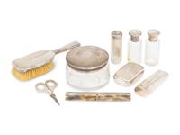 A Cased Gorham Silver Eighteen-Piece Travel Dresser Set Retailed by Cartier