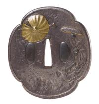 A Gilt Bronze Inlaid Iron Tsuba Height 3 1/4 inches.
