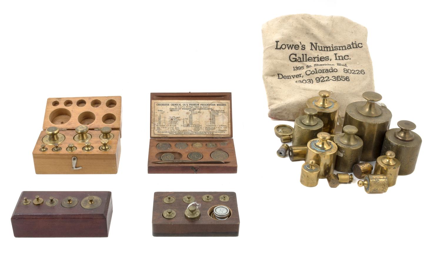 A Collection of Brass Weights Width of first case 5 inches.