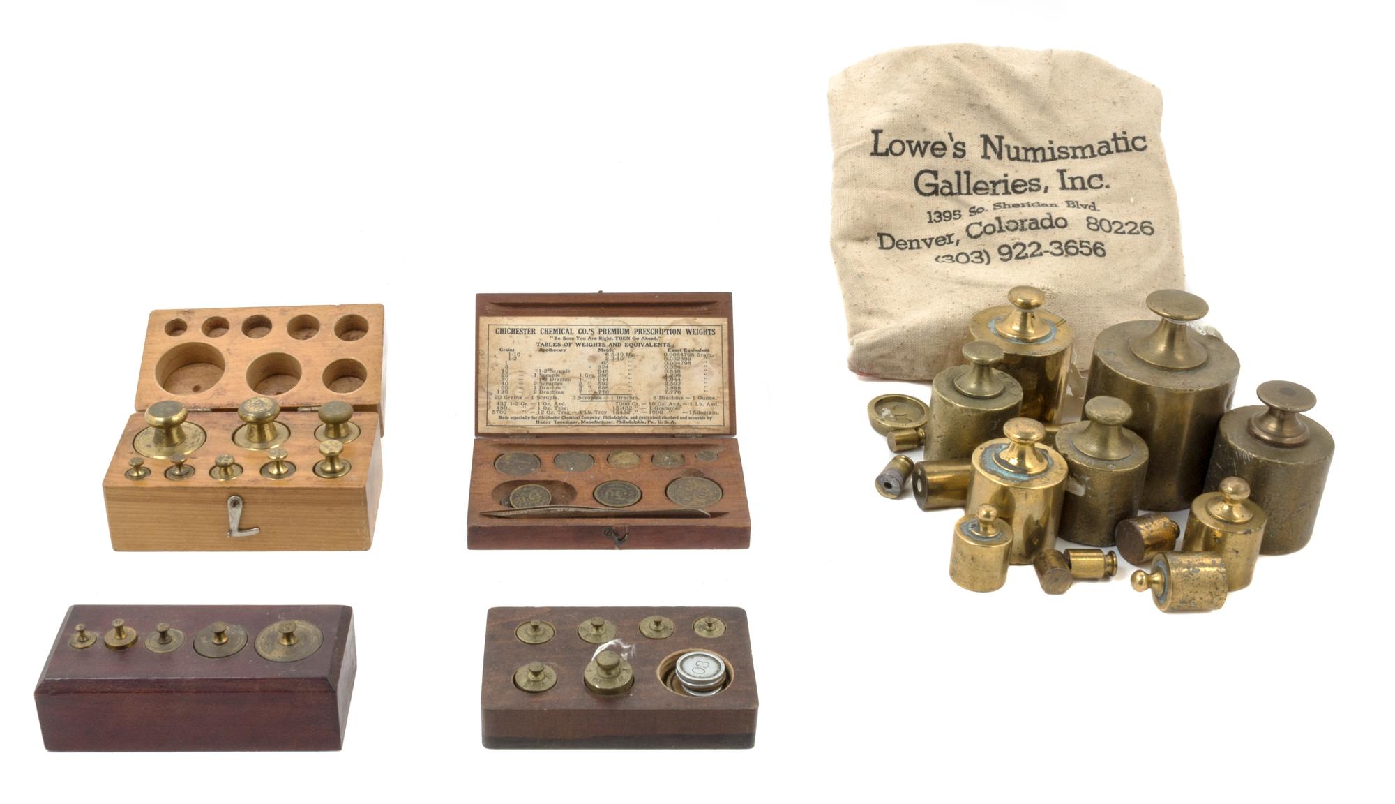 A Collection of Brass Weights Width of first case 5 inches.