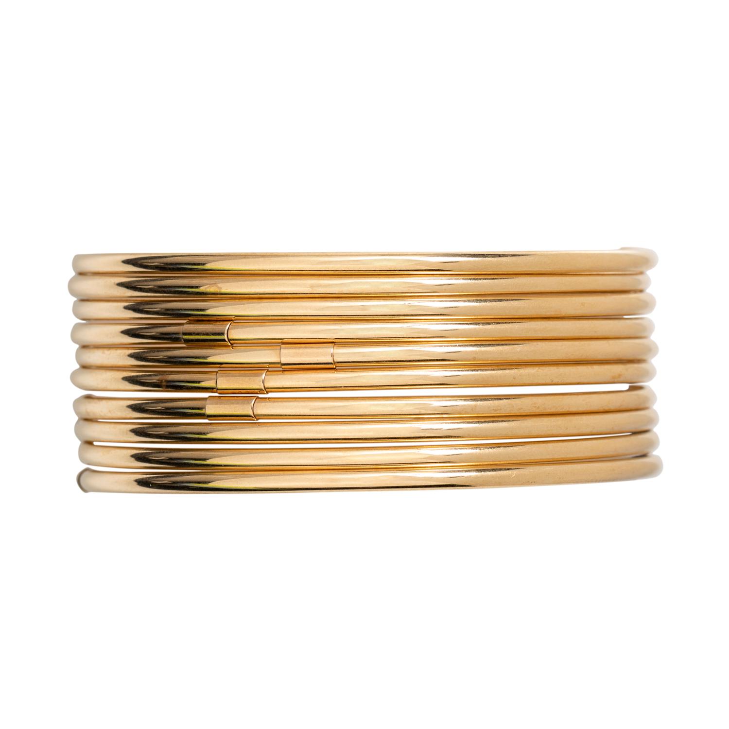 COLLECTION OF YELLOW GOLD BANGLE BRACELETS