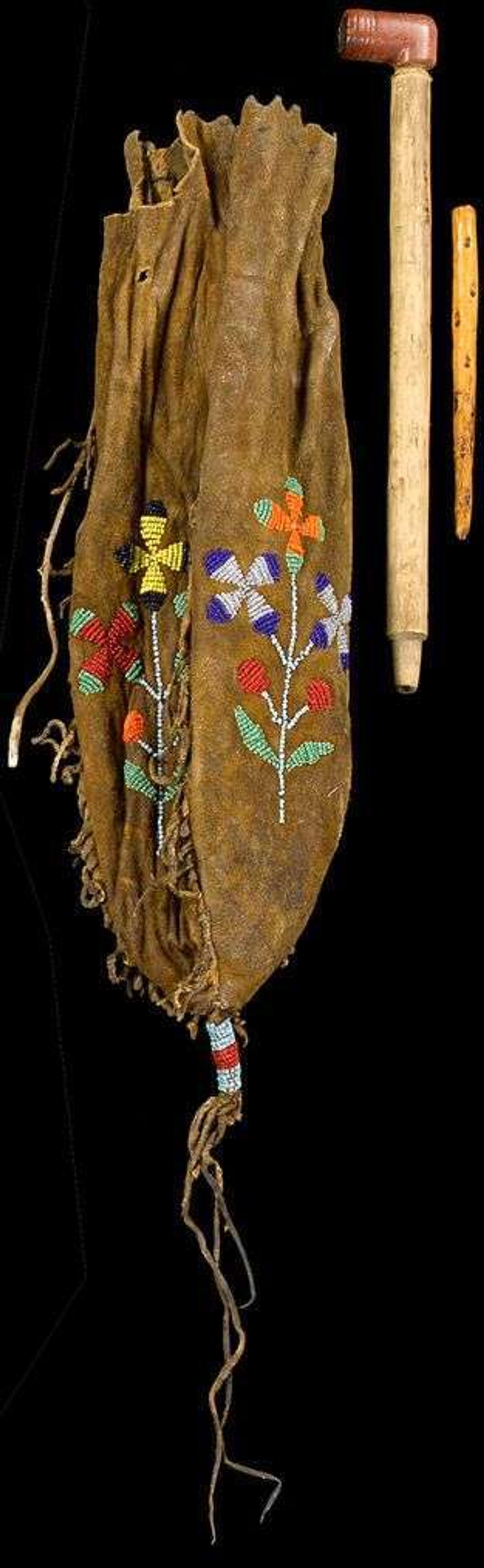 Beaded and fringed hide pipe bag and pipe belonging to Blue Thunder, survivor of The Battle of the Little Bighorn last half 19th century