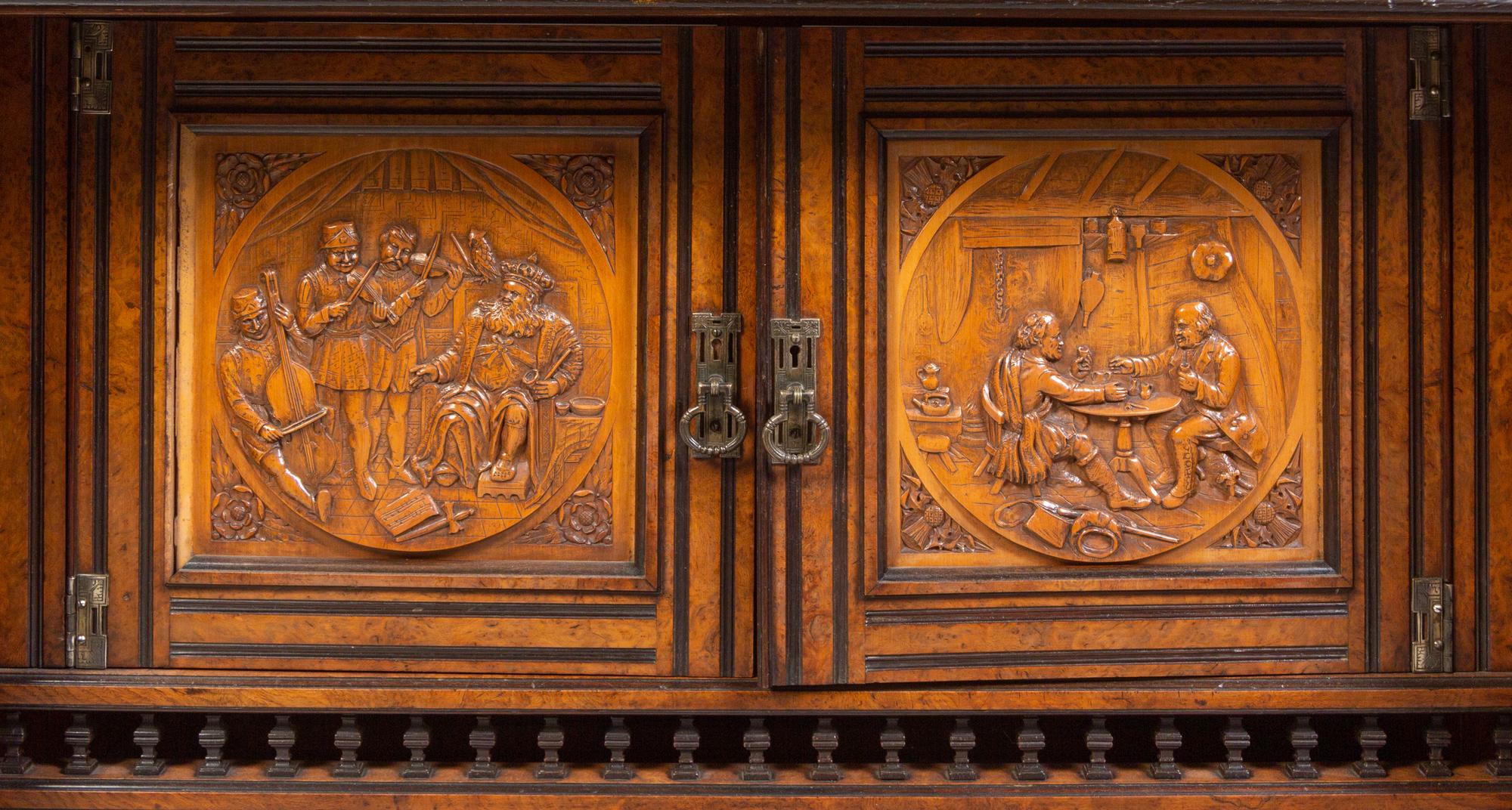 A Continental Carved Walnut and Burlwood Serving Cabinet
