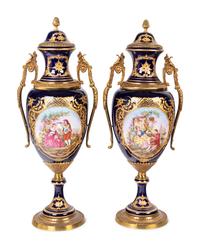 A Pair of Sèvres Style Gilt Metal Mounted Porcelain Urns
