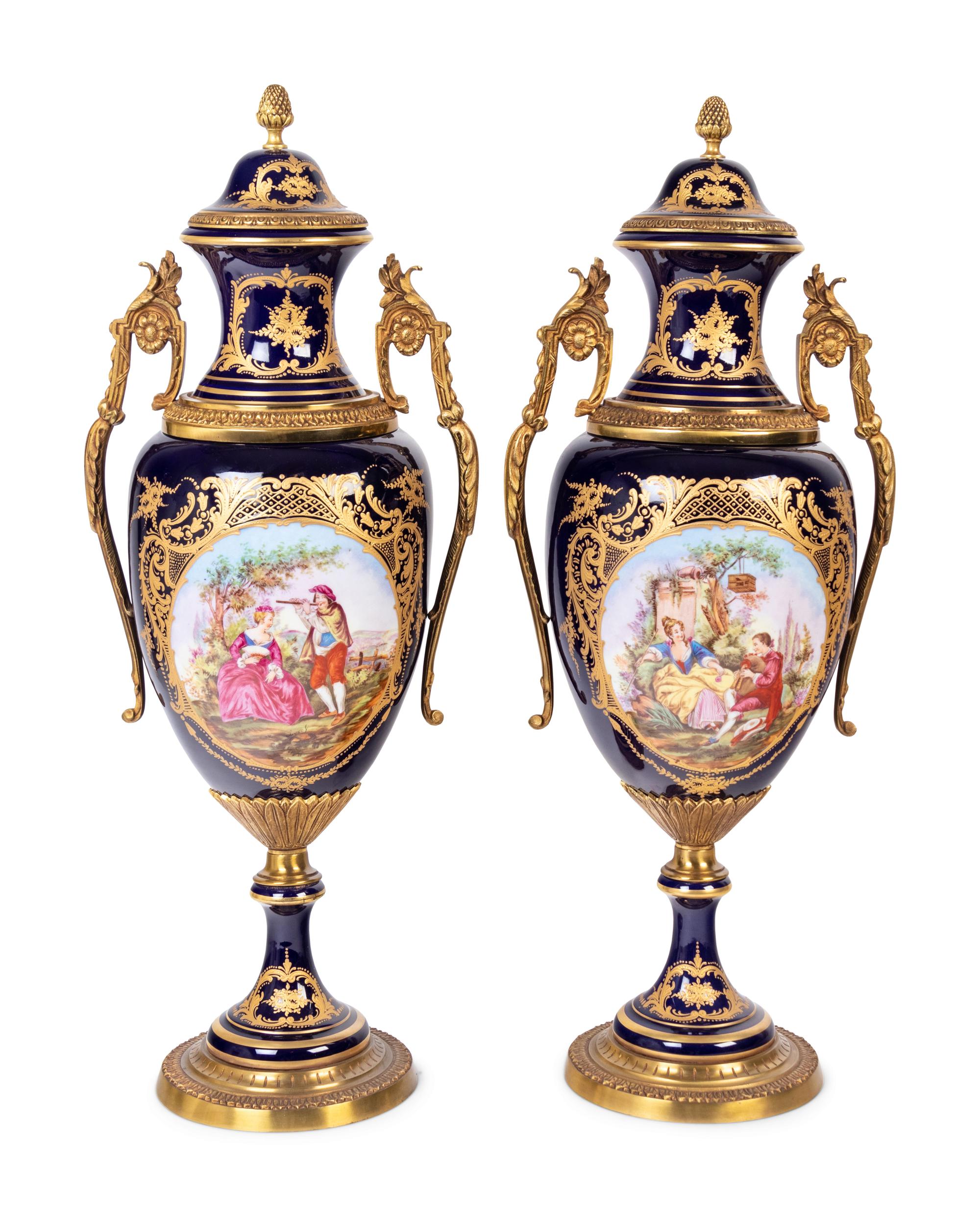 A Pair of Sèvres Style Gilt Metal Mounted Porcelain Urns