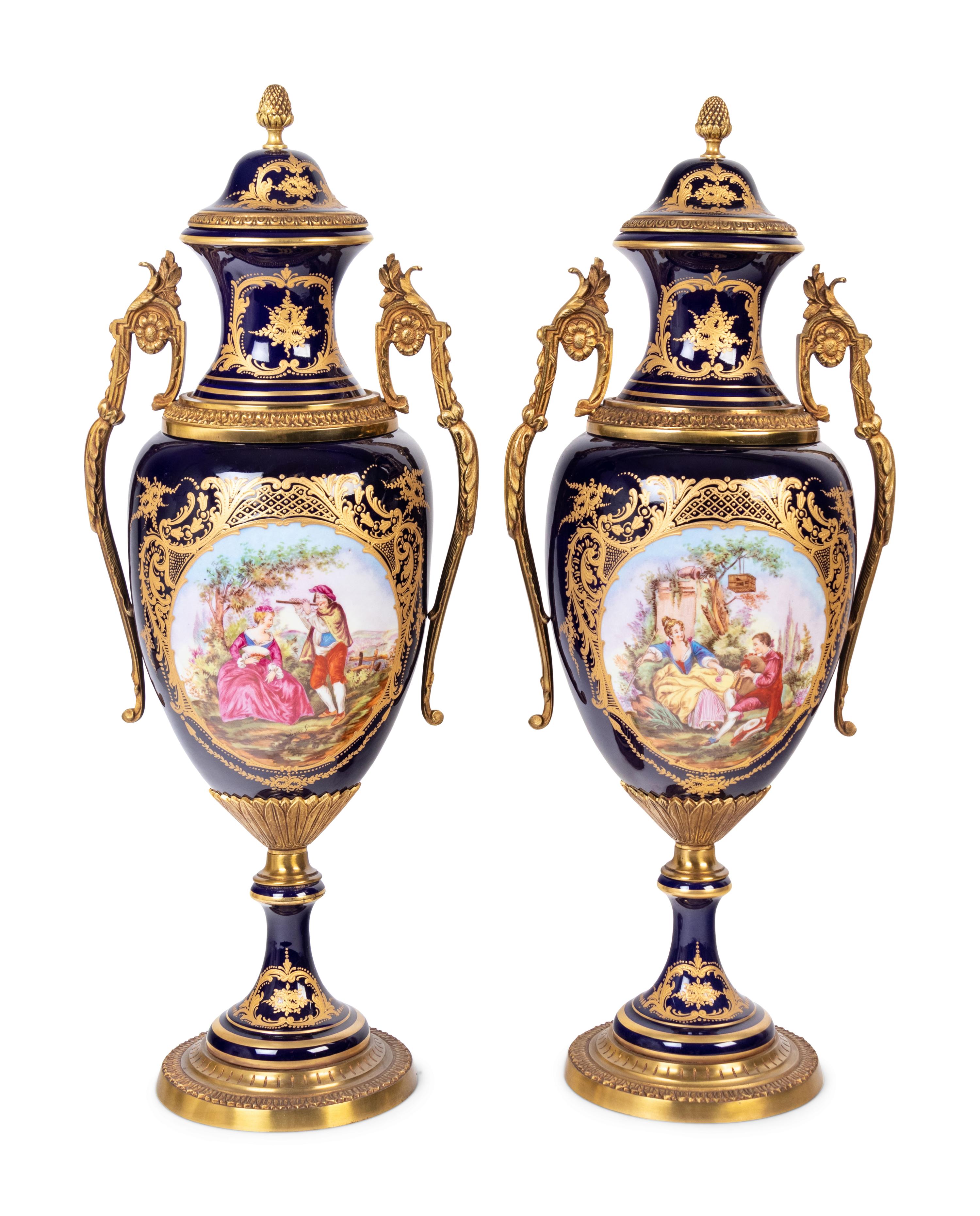 A Pair of Sèvres Style Gilt Metal Mounted Porcelain Urns
